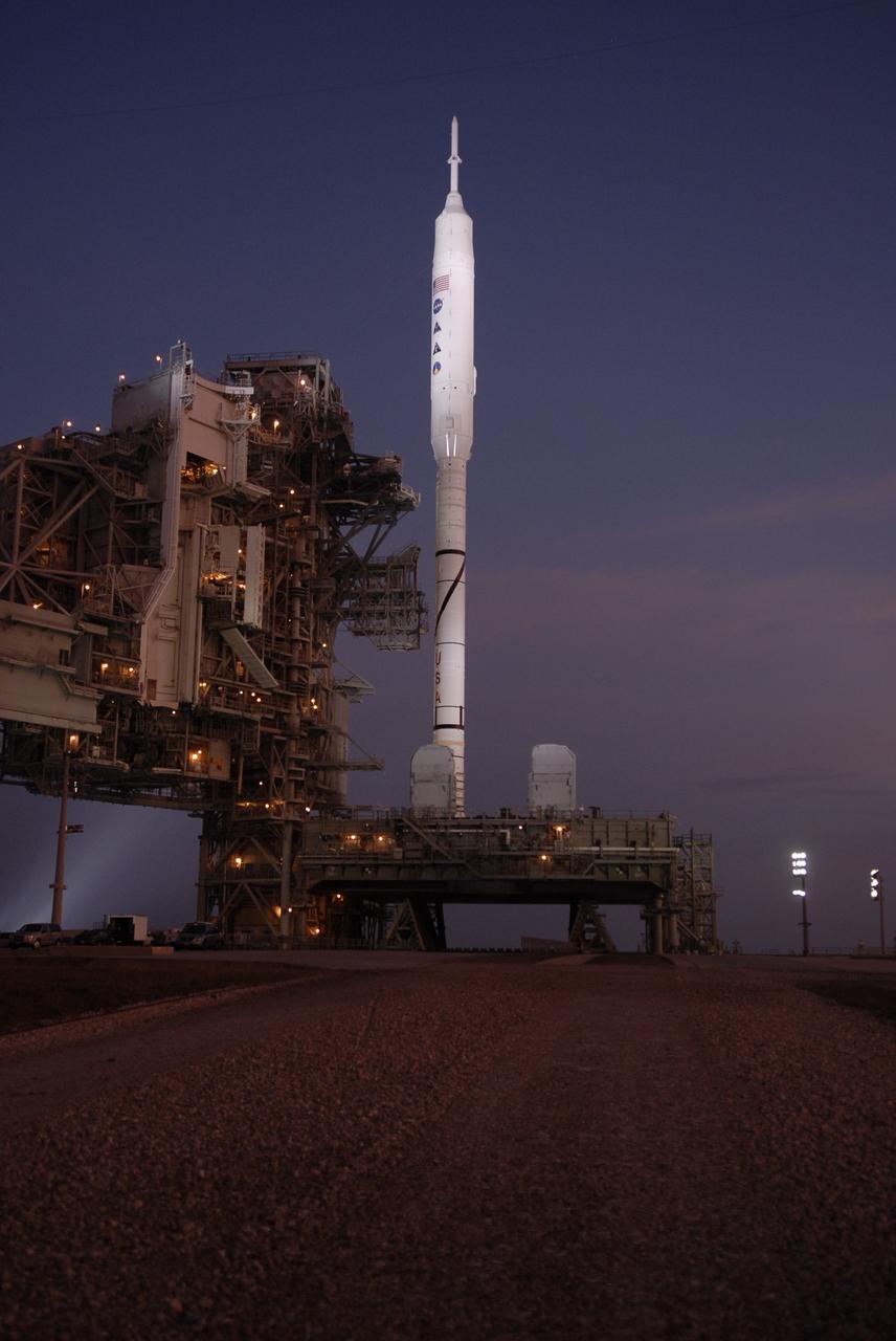 CAPE CANAVERAL, Fla. – Sunrise at Launch Pad 39B at NASA's Kennedy Space Center in Florida reveals the rotating service structure and the arms of the vehicle stabilization system have been retracted from around the Constellation Program's 327-foot-tall Ares I-X rocket for launch. The transfer of the pad from the Space Shuttle Program to the Constellation Program took place May 31. Modifications made to the pad include the removal of shuttle unique subsystems, such as the orbiter access arm and a section of the gaseous oxygen vent arm, and the installation of three 600-foot lightning towers, access platforms, environmental control systems and a vehicle stabilization system. The data returned from more than 700 sensors throughout the rocket will be used to refine the design of future launch vehicles and bring NASA one step closer to reaching its exploration goals. The Ares I-X flight test is targeted for Oct. 27. For information on the Ares I-X vehicle and flight test, visit http://www.nasa.gov/aresIX. Photo credit: NASA/Kim Shiflett