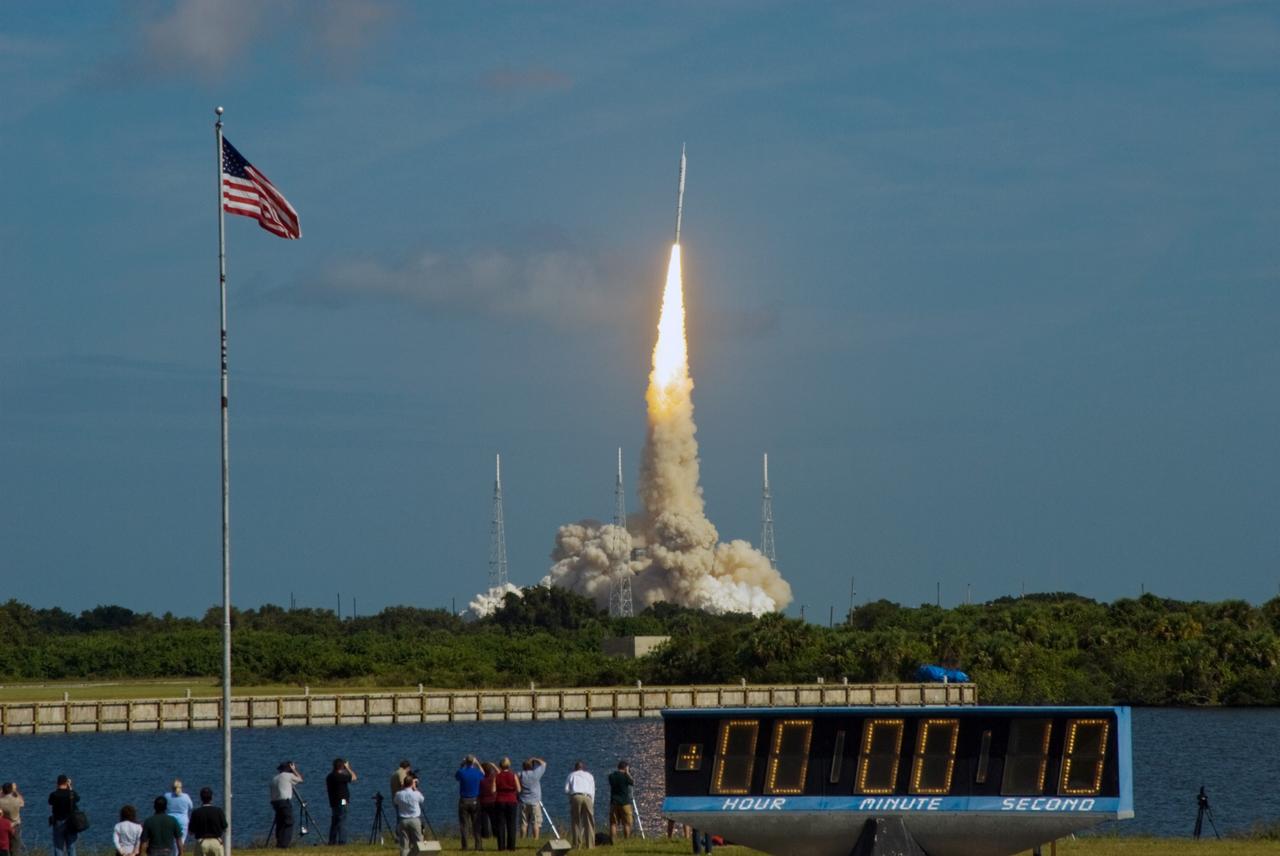 CAPE CANAVERAL, Fla. - The stars and stripes on the American flag reflect NASA's commitment to teamwork as the Constellation Program's Ares I-X test rocket roars off Launch Complex 39B at NASA's Kennedy Space Center in Florida.  The rocket produces 2.96 million pounds of thrust at liftoff and reaches a speed of 100 mph in eight seconds.    Liftoff of the 6-minute flight test was at 11:30 a.m. EDT Oct. 28. This was the first launch from Kennedy's pads of a vehicle other than the space shuttle since the Apollo Program's Saturn rockets were retired.  The parts used to make the Ares I-X booster flew on 30 different shuttle missions ranging from STS-29 in 1989 to STS-106 in 2000. The data returned from more than 700 sensors throughout the rocket will be used to refine the design of future launch vehicles and bring NASA one step closer to reaching its exploration goals.  For information on the Ares I-X vehicle and flight test, visit http://www.nasa.gov/aresIX.  Photo credit: NASA/Jim Grossmann