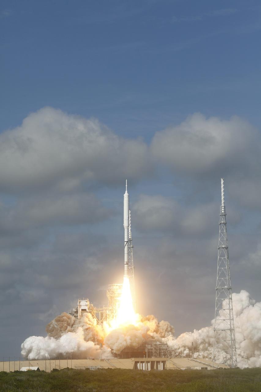 CAPE CANAVERAL, Fla. - Almost twice as tall as Disney's Cinderella Castle, the Constellation Program's 327-foot-tall Ares I-X test rocket lifts off from Launch Complex 39B at NASA's Kennedy Space Center in Florida.  The rocket produces 2.96 million pounds of thrust at liftoff and reaches a speed of 100 mph in eight seconds.    Liftoff of the 6-minute flight test was at 11:30 a.m. EDT Oct. 28. This was the first launch from Kennedy's pads of a vehicle other than the space shuttle since the Apollo Program's Saturn rockets were retired.  The parts used to make the Ares I-X booster flew on 30 different shuttle missions ranging from STS-29 in 1989 to STS-106 in 2000. The data returned from more than 700 sensors throughout the rocket will be used to refine the design of future launch vehicles and bring NASA one step closer to reaching its exploration goals.  For information on the Ares I-X vehicle and flight test, visit http://www.nasa.gov/aresIX.  Photo courtesy of Scott Andrews, Canon