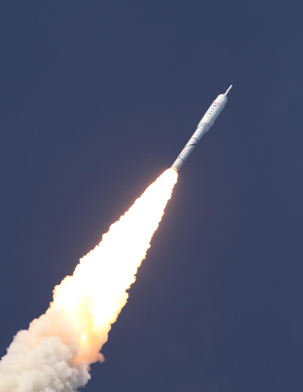 CAPE CANAVERAL, Fla. – A fiery blaze trails the Ares I-X test rocket as it takes off from Launch Pad 39B at NASA's Kennedy Space Center in Florida at 11:30 a.m. EDT Oct. 28. Constellation Program's 327-foot-tall rocket produces 2.96 million pounds of thrust at liftoff and reaches a speed of 100 mph in eight seconds. This was the first launch from Kennedy's pads of a vehicle other than the space shuttle since the Apollo Program's Saturn rockets were retired. The parts used to make the Ares I-X booster flew on 30 different shuttle missions ranging from STS-29 in 1989 to STS-106 in 2000. The data returned from more than 700 sensors throughout the rocket will be used to refine the design of future launch vehicles and bring NASA one step closer to reaching its exploration goals. For information on the Ares I-X vehicle and flight test, visit http://www.nasa.gov/aresIX. Photo credit: NASA/ Kenny Allen