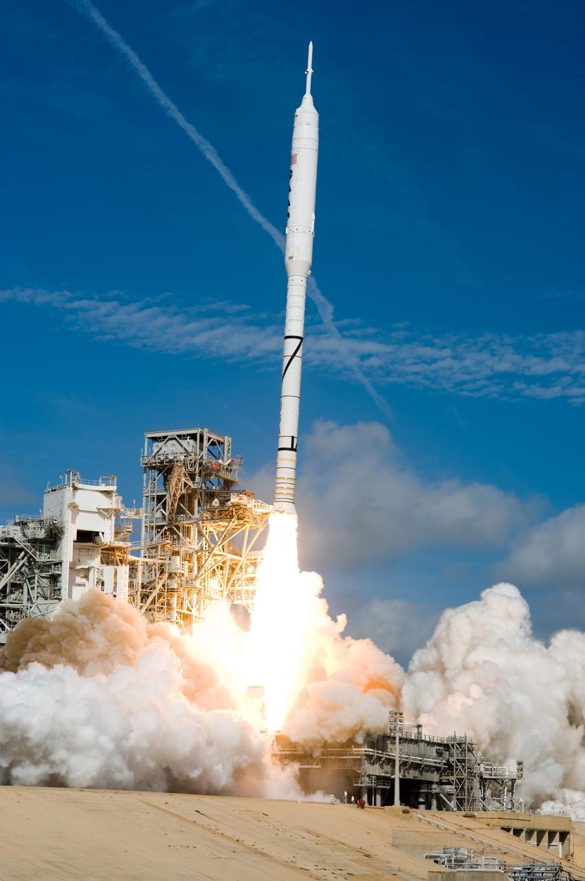 CAPE CANAVERAL, Fla. – Billowing clouds of smoke and steam rise as the Ares I-X test rocket launches from Launch Pad 39B at NASA's Kennedy Space Center in Florida at 11:30 a.m. EDT Oct. 28. NASA’s Constellation Program's 327-foot-tall rocket produces 2.96 million pounds of thrust at liftoff and reaches a speed of 100 mph in eight seconds. This was the first launch from Kennedy's pads of a vehicle other than the space shuttle since the Apollo Program's Saturn rockets were retired. The parts used to make the Ares I-X booster flew on 30 different shuttle missions ranging from STS-29 in 1989 to STS-106 in 2000. The data returned from more than 700 sensors throughout the rocket will be used to refine the design of future launch vehicles and bring NASA one step closer to reaching its exploration goals. For information on the Ares I-X vehicle and flight test, visit http://www.nasa.gov/aresIX. A Delta II rocket appears to erupt from the undulating clouds of smoke below Photo credit: NASA/Tony Gray and Tom Farrar