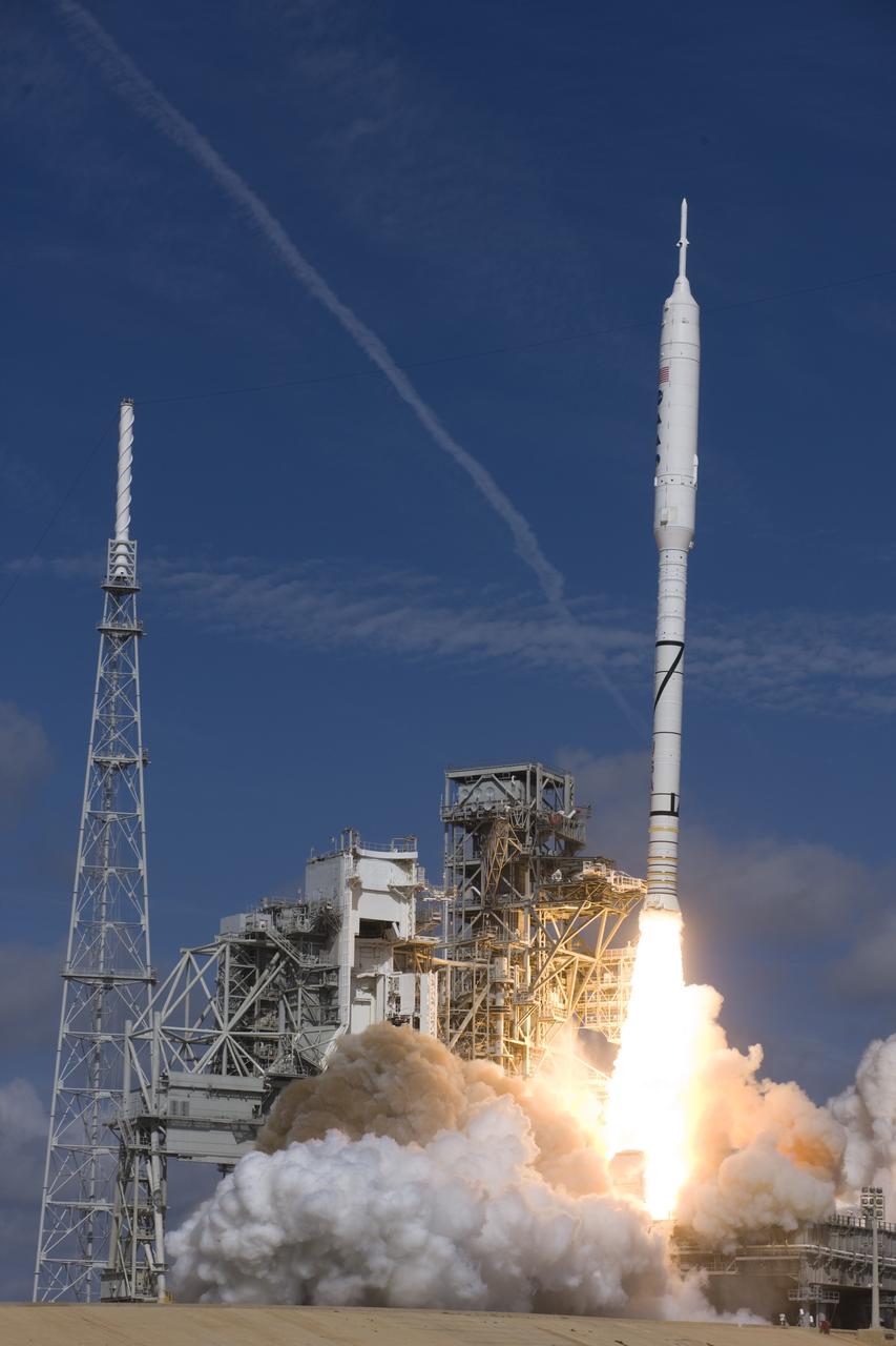 CAPE CANAVERAL, Fla. – NASA’s Ares I-X test rocket clears the tower at Launch Pad 39B at NASA's Kennedy Space Center in Florida at 11:30 a.m. EDT on Oct. 28. The rocket produces 2.96 million pounds of thrust at liftoff and reaches a speed of 100 mph in eight seconds. This was the first launch from Kennedy's pads of a vehicle other than the space shuttle since the Apollo Program's Saturn rockets were retired. The parts used to make the Ares I-X booster flew on 30 different shuttle missions ranging from STS-29 in 1989 to STS-106 in 2000. The data returned from more than 700 sensors throughout the rocket will be used to refine the design of future launch vehicles and bring NASA one step closer to reaching its exploration goals. For information on the Ares I-X vehicle and flight test, visit http://www.nasa.gov/aresIX. Photo credit: Courtesy of Scott Andrews