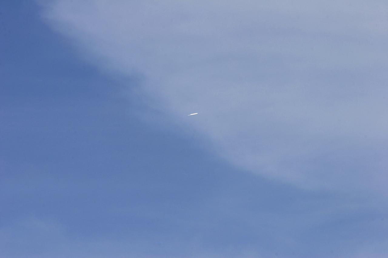 CAPE CANAVERAL, Fla. – The upper stage of the Ares I-X rocket falls toward the Atlantic Ocean off the coast of NASA's Kennedy Space Center in Florida following the launch of the flight test mission.    Liftoff of the 6-minute flight test was at 11:30 a.m. EDT Oct. 28. This was the first launch from Kennedy's pads of a vehicle other than the space shuttle since the Apollo Program's Saturn rockets were retired.  The parts used to make the Ares I-X booster flew on 30 different shuttle missions ranging from STS-29 in 1989 to STS-106 in 2000. The data returned from more than 700 sensors throughout the rocket will be used to refine the design of future launch vehicles and bring NASA one step closer to reaching its exploration goals.  For information on the Ares I-X vehicle and flight test, visit http://www.nasa.gov/aresIX.  Photo credit: United Space Alliance