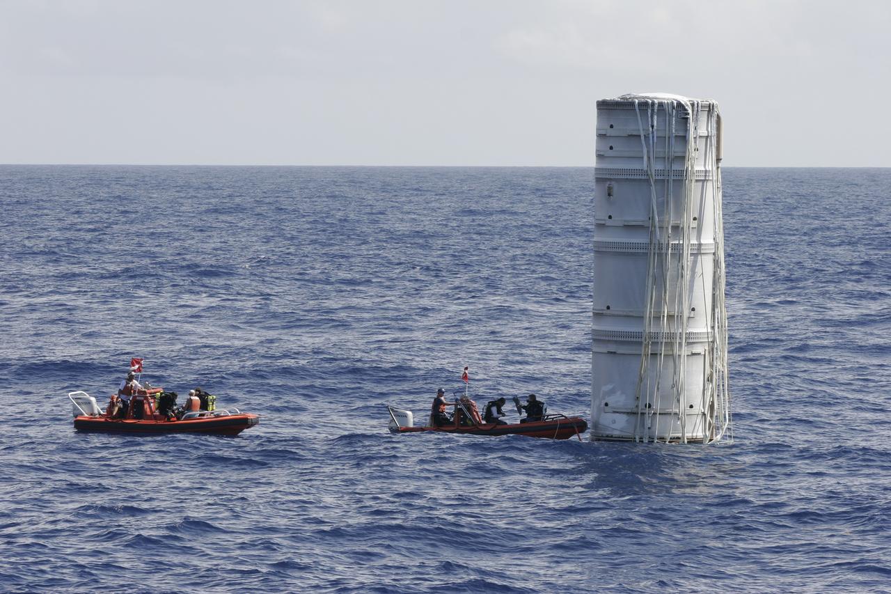 CAPE CANAVERAL, Fla. – In the Atlantic Ocean off the coast of NASA's Kennedy Space Center in Florida, United Space Alliance Recovery Operations divers and personnel approach the floating Ares I-X first stage following the launch of the flight test mission.    Liftoff of the 6-minute flight test was at 11:30 a.m. EDT Oct. 28. This was the first launch from Kennedy's pads of a vehicle other than the space shuttle since the Apollo Program's Saturn rockets were retired.  The parts used to make the Ares I-X booster flew on 30 different shuttle missions ranging from STS-29 in 1989 to STS-106 in 2000. The data returned from more than 700 sensors throughout the rocket will be used to refine the design of future launch vehicles and bring NASA one step closer to reaching its exploration goals.  For information on the Ares I-X vehicle and flight test, visit http://www.nasa.gov/aresIX.  Photo credit: United Space Alliance