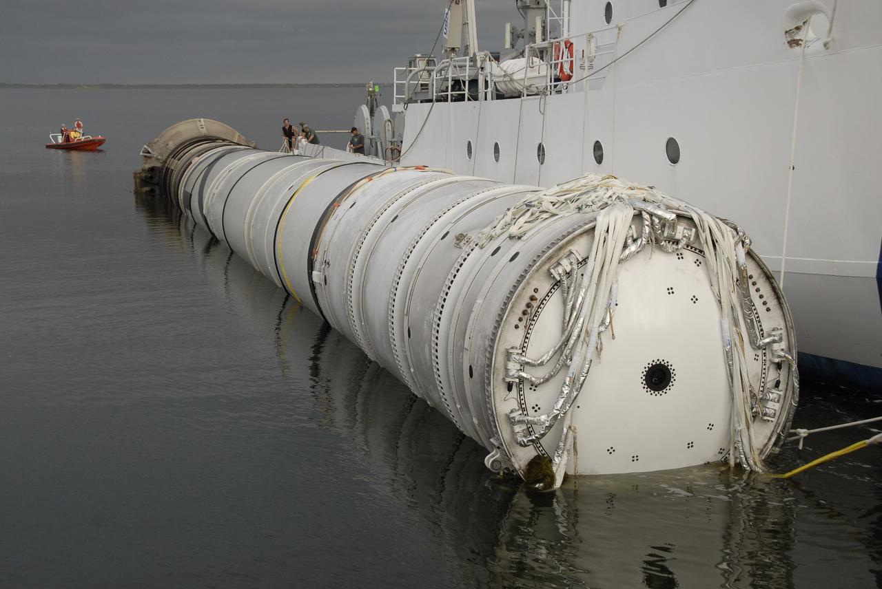 CAPE CANAVERAL, Fla. – The solid rocket booster recovery ship Freedom Star, towing the spent first stage of NASA's Ares I-X rocket through the Banana River, delivers the booster to Hangar AF at Cape Canaveral Air Force Station in Florida. Following the launch of the Ares I-X flight test, the booster splashed down in the Atlantic Ocean and was recovered.    Liftoff of the 6-minute flight test was at 11:30 a.m. EDT Oct. 28. This was the first launch from Kennedy's pads of a vehicle other than the space shuttle since the Apollo Program's Saturn rockets were retired.  The parts used to make the Ares I-X booster flew on 30 different shuttle missions ranging from STS-29 in 1989 to STS-106 in 2000. The data returned from more than 700 sensors throughout the rocket will be used to refine the design of future launch vehicles and bring NASA one step closer to reaching its exploration goals.  For information on the Ares I-X vehicle and flight test, visit http://www.nasa.gov/aresIX.  Photo credit: NASA/Kim Shiflett