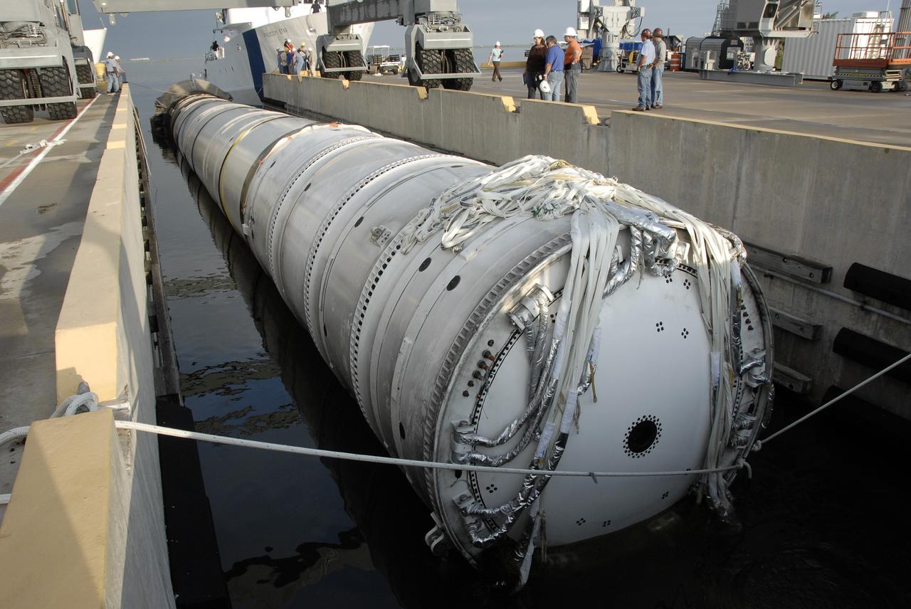 CAPE CANAVERAL, Fla. – At Hangar AF on Cape Canaveral Air Force Station in Florida, the spent first stage of NASA's Ares I-X rocket is secured in a slip.  The solid rocket booster recovery ship Freedom Star recovered the booster after it splashed down in the Atlantic Ocean following its flight test.    Liftoff of the 6-minute flight test was at 11:30 a.m. EDT Oct. 28. This was the first launch from Kennedy's pads of a vehicle other than the space shuttle since the Apollo Program's Saturn rockets were retired.  The parts used to make the Ares I-X booster flew on 30 different shuttle missions ranging from STS-29 in 1989 to STS-106 in 2000. The data returned from more than 700 sensors throughout the rocket will be used to refine the design of future launch vehicles and bring NASA one step closer to reaching its exploration goals.  For information on the Ares I-X vehicle and flight test, visit http://www.nasa.gov/aresIX.  Photo credit: NASA/Kim Shiflett