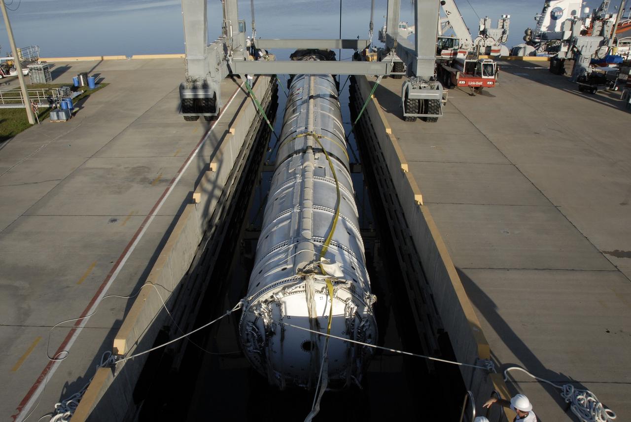 CAPE CANAVERAL, Fla. – At Hangar AF on Cape Canaveral Air Force Station in Florida, the spent first stage of NASA's Ares I-X rocket, secured in a slip, awaits inspection.  The booster was recovered by the solid rocket booster recovery ship Freedom Star after it splashed down in the Atlantic Ocean following its flight test.    Liftoff of the 6-minute flight test was at 11:30 a.m. EDT Oct. 28. This was the first launch from Kennedy's pads of a vehicle other than the space shuttle since the Apollo Program's Saturn rockets were retired.  The parts used to make the Ares I-X booster flew on 30 different shuttle missions ranging from STS-29 in 1989 to STS-106 in 2000. The data returned from more than 700 sensors throughout the rocket will be used to refine the design of future launch vehicles and bring NASA one step closer to reaching its exploration goals.  For information on the Ares I-X vehicle and flight test, visit http://www.nasa.gov/aresIX.  Photo credit: NASA/Kim Shiflett