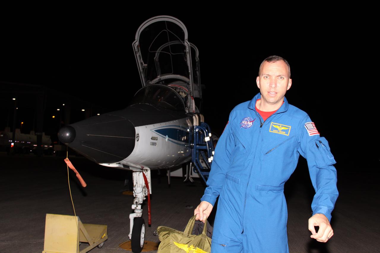 CAPE CANAVERAL, Fla. - STS-129 Mission Specialist Randy Bresnik disembarks from a T-38 jet at the Shuttle Landing Facility at NASA's Kennedy Space Center in Florida.  The six astronauts for space shuttle Atlantis’ STS-129 mission have arrived at Kennedy for their launch dress rehearsal, the Terminal Countdown Demonstration Test.    Additional training associated with the test was done last month, but the simulated countdown was postponed because of a scheduling conflict with the launch of NASA’s Ares I-X test rocket.  Launch of Atlantis on its STS-129 mission to the International Space Station is set for Nov. 16. On STS-129, the crew will deliver to the station two spare gyroscopes, two nitrogen tank assemblies, two pump modules, an ammonia tank assembly and a spare latching end effector for the station's robotic arm.  For information on the STS-129 mission objectives and crew, visit http://www.nasa.gov/mission_pages/shuttle/shuttlemissions/sts129/index.html. Photo credit: NASA/Troy Cryder