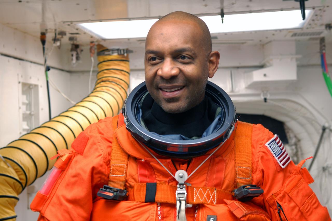CAPE CANAVERAL, Fla. - On Launch Pad 39A at NASA's Kennedy Space Center in Florida, the closeout crew in the White Room help STS-129 Mission Specialist Robert L. Satcher Jr. complete his suit-up before entering space shuttle Atlantis. The six astronauts for space shuttle Atlantis’ STS-129 mission are participating in their launch dress rehearsal, the Terminal Countdown Demonstration Test. Additional training associated with the test was done last month, but the simulated countdown was postponed because of a scheduling conflict with the launch of NASA’s Ares I-X test rocket. Launch of Atlantis on its STS-129 mission to the International Space Station is set for Nov. 16. On STS-129, the crew will deliver to the station two spare gyroscopes, two nitrogen tank assemblies, two pump modules, an ammonia tank assembly and a spare latching end effector for the station's robotic arm. For information on the STS-129 crew and mission objectives, visit http://www.nasa.gov/mission_pages/shuttle/shuttlemissions/sts129/index.html. Photo credit: NASA/Jim Grossmann