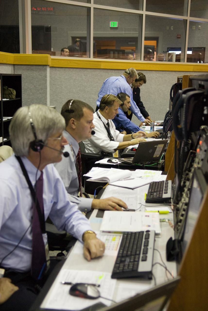 CAPE CANAVERAL, Fla. - The prime launch team for the Ares I-X flight test monitors the countdown from consoles in the Young-Crippen Firing Room in the Launch Control Center at NASA's Kennedy Space Center in Florida.    This will be the first launch from Kennedy's pads of a vehicle other than the space shuttle since the Apollo Program's Saturn rockets were retired.  The parts used to make the Ares I-X booster flew on 30 different shuttle missions ranging from STS-29 in 1989 to STS-106 in 2000. The data returned from more than 700 sensors throughout the rocket will be used to refine the design of future launch vehicles and bring NASA one step closer to reaching its exploration goals.  For information on the Ares I-X vehicle and flight test, visit http://www.nasa.gov/aresIX.  Photo credit: NASA/Kim Shiflett