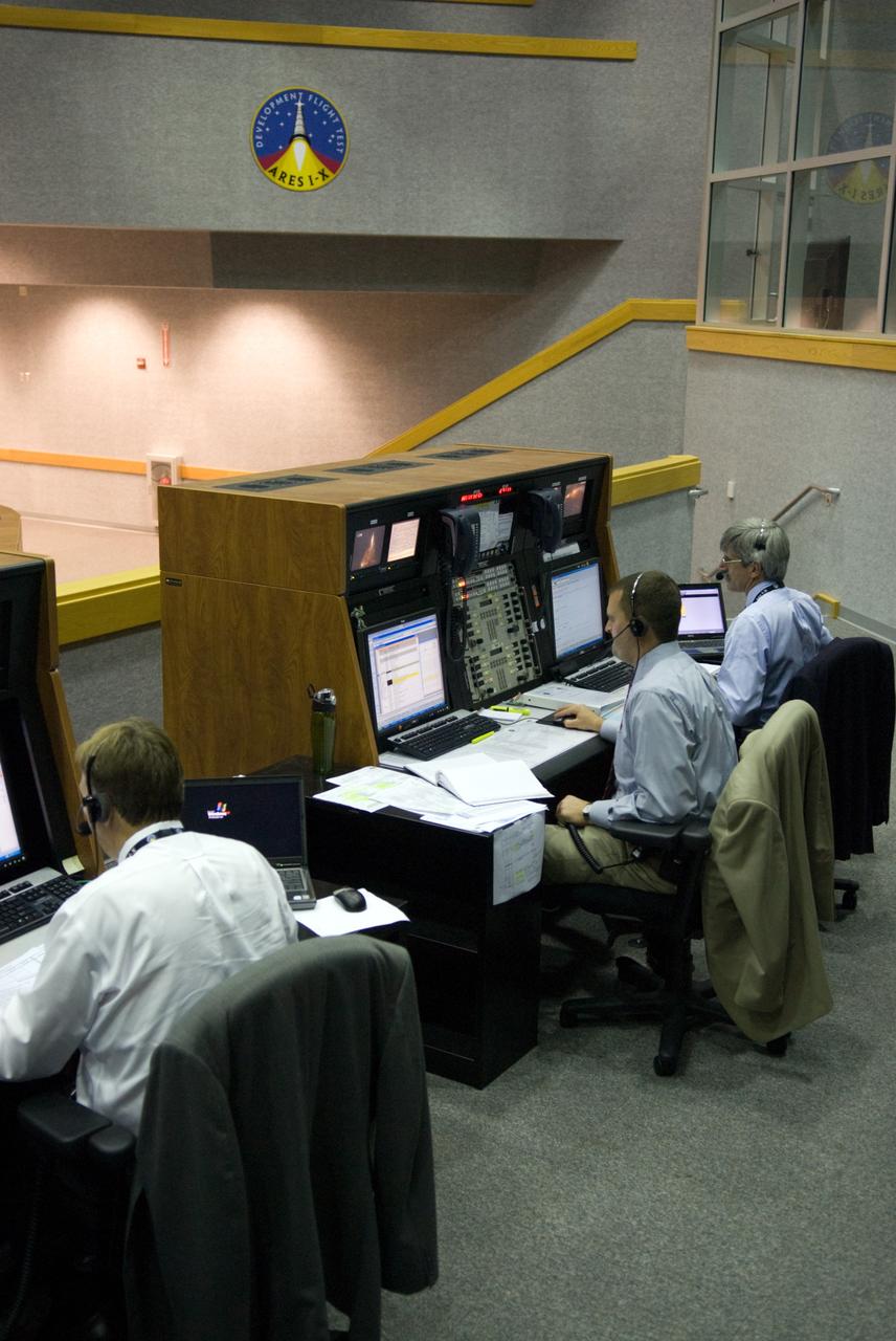 CAPE CANAVERAL, Fla. - The prime launch team for the Ares I-X flight test monitors the countdown from consoles in the Young-Crippen Firing Room in the Launch Control Center at NASA's Kennedy Space Center in Florida.    This will be the first launch from Kennedy's pads of a vehicle other than the space shuttle since the Apollo Program's Saturn rockets were retired.  The parts used to make the Ares I-X booster flew on 30 different shuttle missions ranging from STS-29 in 1989 to STS-106 in 2000. The data returned from more than 700 sensors throughout the rocket will be used to refine the design of future launch vehicles and bring NASA one step closer to reaching its exploration goals.  For information on the Ares I-X vehicle and flight test, visit http://www.nasa.gov/aresIX.  Photo credit: NASA/Kim Shiflett