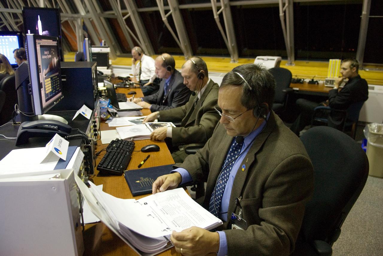 CAPE CANAVERAL, Fla. - The launch authority team for the Ares I-X flight test monitors the countdown from consoles in the Operations Management Room of the Young-Crippen Firing Room, a glass partitioned area overlooking the main floor, in the Launch Control Center at NASA's Kennedy Space Center in Florida.    This will be the first launch from Kennedy's pads of a vehicle other than the space shuttle since the Apollo Program's Saturn rockets were retired.  The parts used to make the Ares I-X booster flew on 30 different shuttle missions ranging from STS-29 in 1989 to STS-106 in 2000. The data returned from more than 700 sensors throughout the rocket will be used to refine the design of future launch vehicles and bring NASA one step closer to reaching its exploration goals.  For information on the Ares I-X vehicle and flight test, visit http://www.nasa.gov/aresIX.  Photo credit: NASA/Kim Shiflett