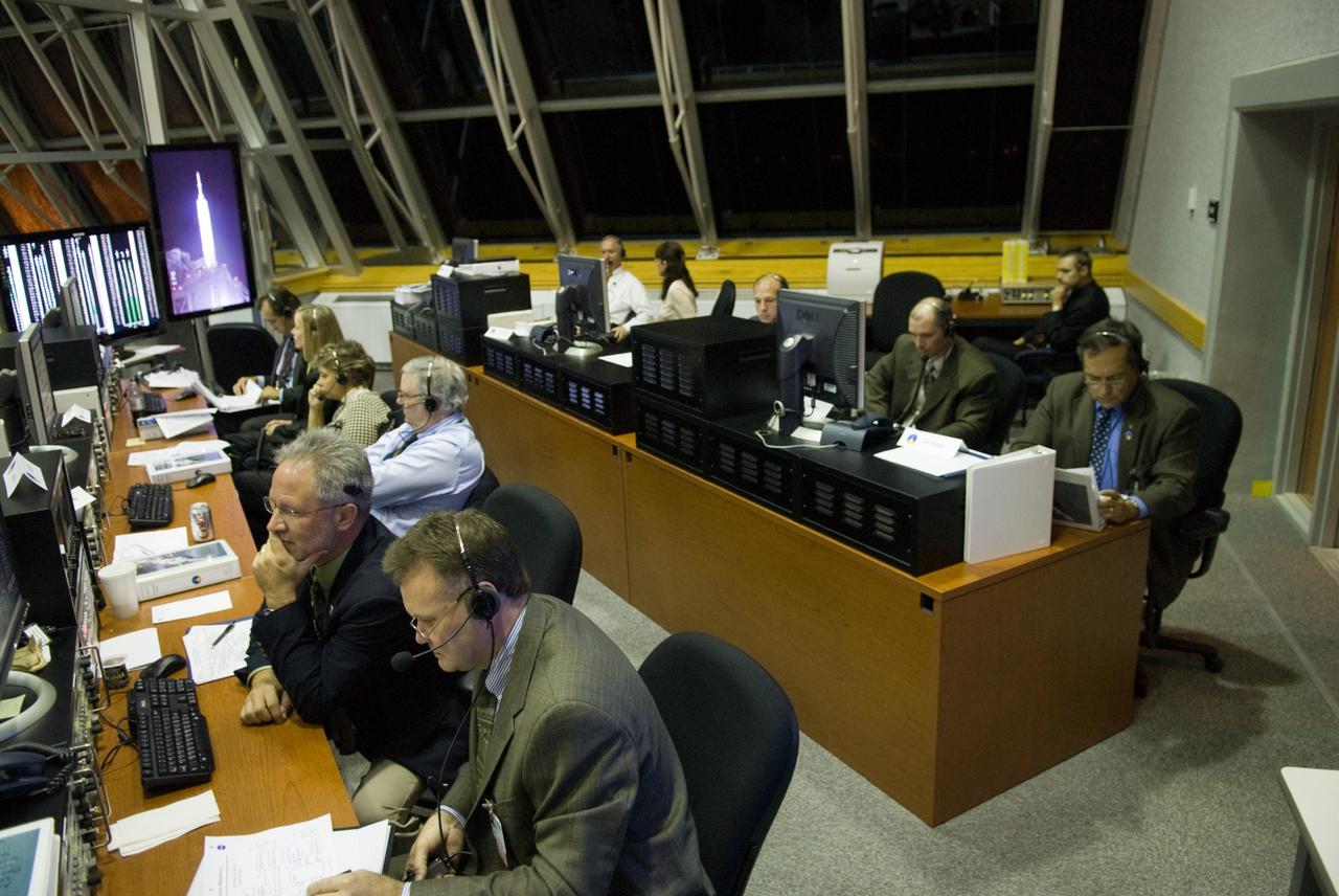 CAPE CANAVERAL, Fla. - The launch authority team for the Ares I-X flight test monitors the countdown from consoles in the Operations Management Room of the Young-Crippen Firing Room, a glass partitioned area overlooking the main floor, in the Launch Control Center at NASA's Kennedy Space Center in Florida.    This will be the first launch from Kennedy's pads of a vehicle other than the space shuttle since the Apollo Program's Saturn rockets were retired.  The parts used to make the Ares I-X booster flew on 30 different shuttle missions ranging from STS-29 in 1989 to STS-106 in 2000. The data returned from more than 700 sensors throughout the rocket will be used to refine the design of future launch vehicles and bring NASA one step closer to reaching its exploration goals.  For information on the Ares I-X vehicle and flight test, visit http://www.nasa.gov/aresIX.  Photo credit: NASA/Kim Shiflett