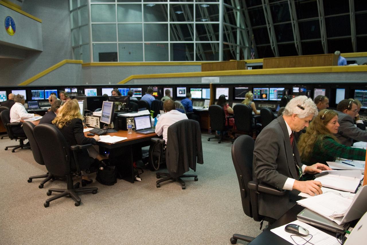 CAPE CANAVERAL, Fla. - The prime launch team for the Ares I-X flight test monitors the countdown from consoles in the Young-Crippen Firing Room in the Launch Control Center at NASA's Kennedy Space Center in Florida.    This will be the first launch from Kennedy's pads of a vehicle other than the space shuttle since the Apollo Program's Saturn rockets were retired.  The parts used to make the Ares I-X booster flew on 30 different shuttle missions ranging from STS-29 in 1989 to STS-106 in 2000. The data returned from more than 700 sensors throughout the rocket will be used to refine the design of future launch vehicles and bring NASA one step closer to reaching its exploration goals.  For information on the Ares I-X vehicle and flight test, visit http://www.nasa.gov/aresIX.  Photo credit: NASA/Kim Shiflett
