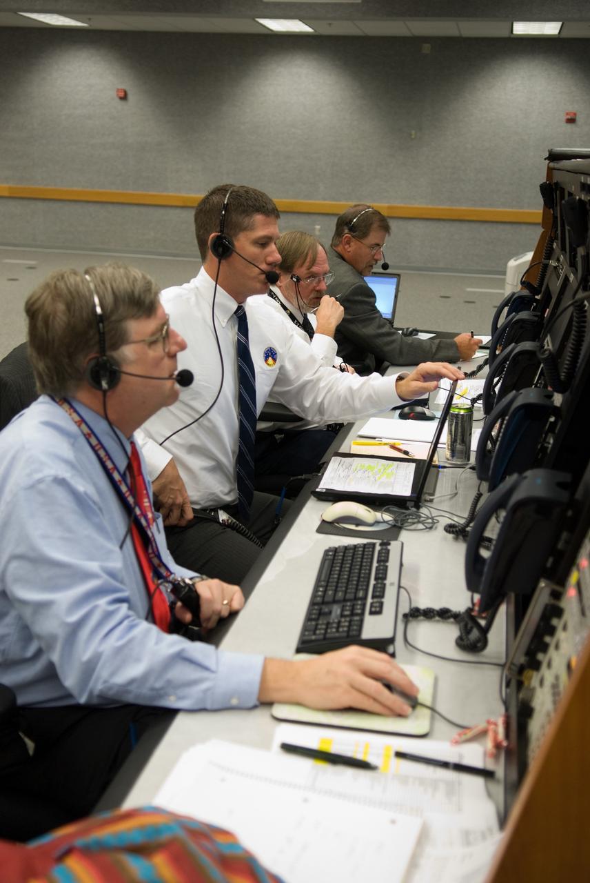 CAPE CANAVERAL, Fla. - The prime launch team for the Ares I-X flight test monitors the countdown from consoles in the Young-Crippen Firing Room in the Launch Control Center at NASA's Kennedy Space Center in Florida.    This will be the first launch from Kennedy's pads of a vehicle other than the space shuttle since the Apollo Program's Saturn rockets were retired.  The parts used to make the Ares I-X booster flew on 30 different shuttle missions ranging from STS-29 in 1989 to STS-106 in 2000. The data returned from more than 700 sensors throughout the rocket will be used to refine the design of future launch vehicles and bring NASA one step closer to reaching its exploration goals.  For information on the Ares I-X vehicle and flight test, visit http://www.nasa.gov/aresIX.  Photo credit: NASA/Kim Shiflett