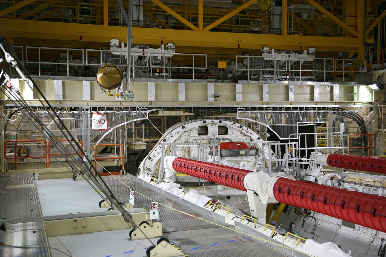 CAPE CANAVERAL, Fla. - In Orbiter Processing Facility Bay 3 at NASA's Kennedy Space Center in Florida, a crane lifts the gaseous nitrogen tank from space shuttle Discovery's payload bay with the aid of a "fish pole" lifting fixture. The tank is being removed during processing for the shuttle's STS-131 mission to the International Space Station. The tanks are used for atmosphere conditioning and for moving potable water in the crew module. The seven-member STS-131 crew will deliver a Multi-Purpose Logistics Module filled with science racks to be transferred to laboratories on the station. Three spacewalks will include work to attach a spare ammonia tank assembly to the station's exterior and return a European experiment from outside the station's Columbus module. This will be the 33rd shuttle mission to the station. Launch is targeted for March 18, 2010. Photo credit: NASA/Troy Cryder