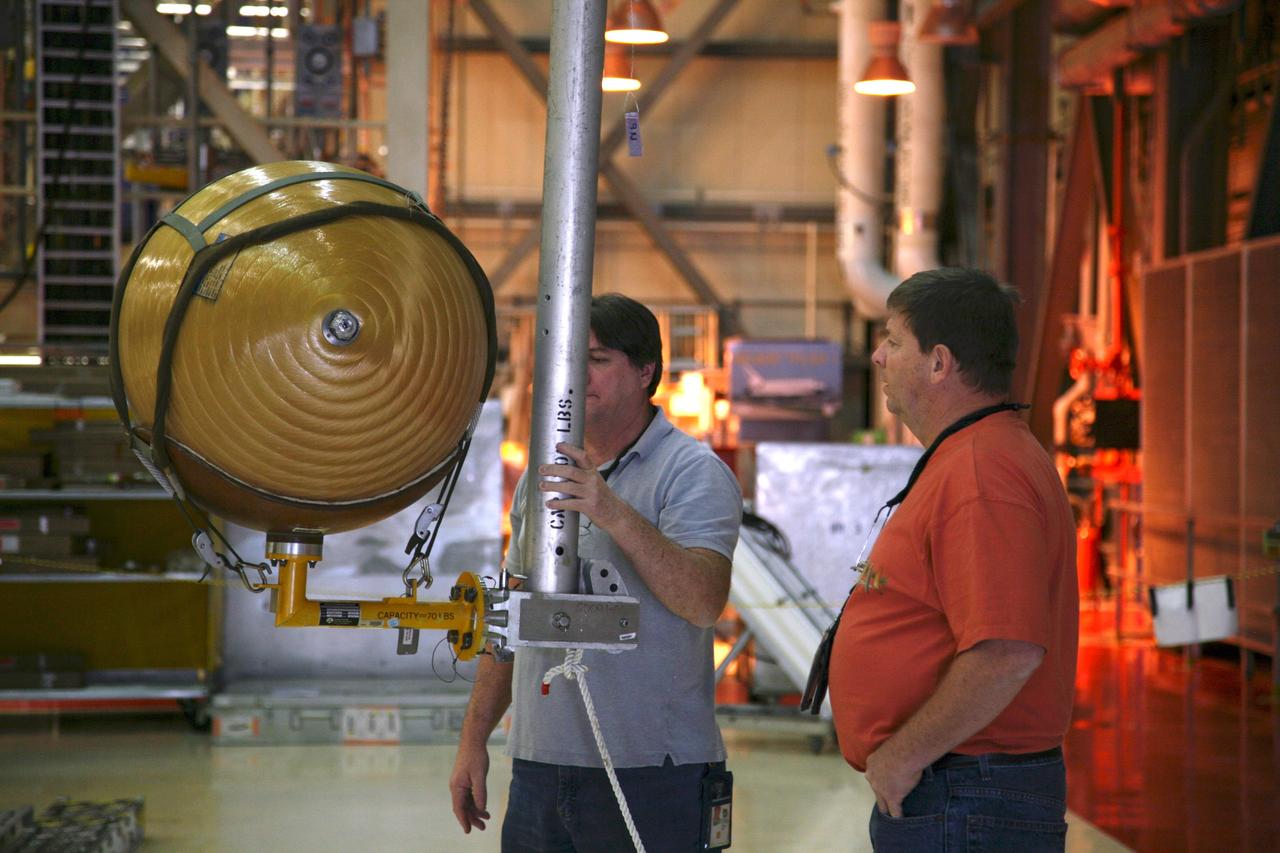 CAPE CANAVERAL, Fla. - In Orbiter Processing Facility Bay 3 at NASA's Kennedy Space Center in Florida, the gaseous nitrogen tank has been removed from space shuttle Discovery's payload bay during processing for the shuttle's STS-131 mission to the International Space Station. The tanks are used for atmosphere conditioning and for moving potable water in the crew module. The seven-member STS-131 crew will deliver a Multi-Purpose Logistics Module filled with science racks to be transferred to laboratories on the station. Three spacewalks will include work to attach a spare ammonia tank assembly to the station's exterior and return a European experiment from outside the station's Columbus module. This will be the 33rd shuttle mission to the station. Launch is targeted for March 18, 2010. Photo credit: NASA/Troy Cryder