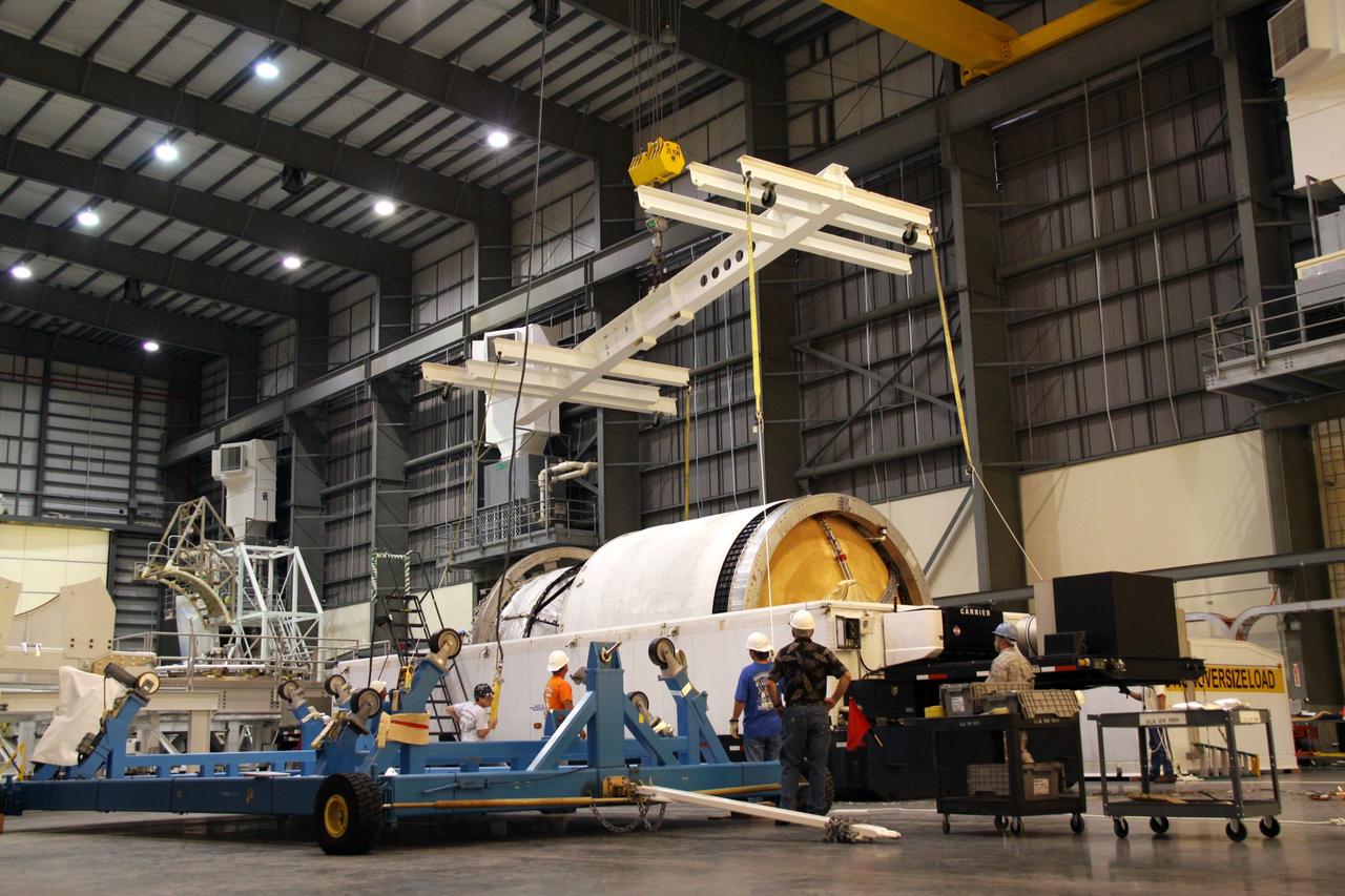 CAPE CANAVERAL, Fla. – Workers prepare to lift the second stage of a Delta IV from its transporter in the Horizontal Integration Facility at Launch Complex 37 on Cape Canaveral Air Force Station in Florida. This United Launch Alliance Delta IV rocket is the vehicle slated to launch GOES-P, the latest Geostationary Operational Environmental Satellite developed by NASA for the National Oceanic and Atmospheric Administration, or NOAA. Processing of the Delta IV is on track for launch, targeted for March 4, 2010. For information on GOES-P, visit http://goespoes.gsfc.nasa.gov/goes/spacecraft/n_p_spacecraft.html. Photo credit: NASA/Jack Pfaller