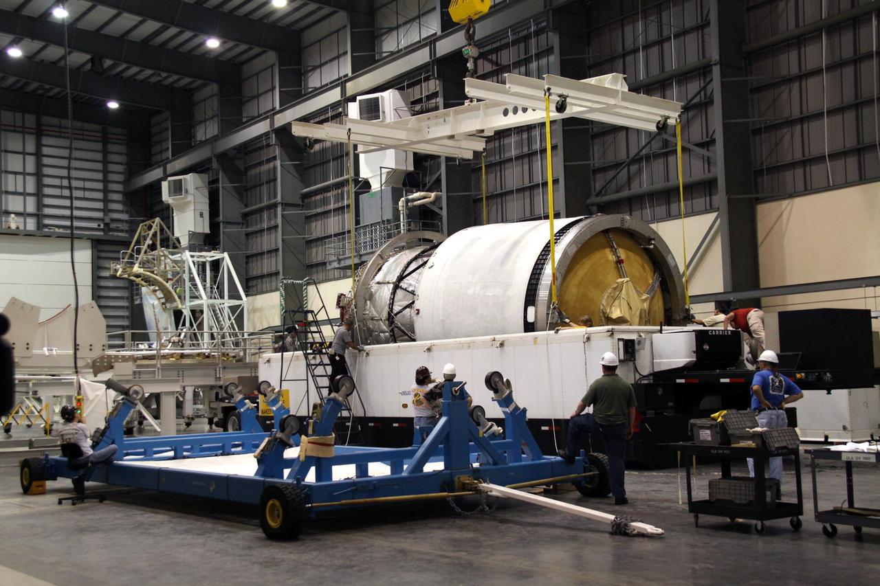 CAPE CANAVERAL, Fla. – Workers monitor the second stage of a Delta IV as a crane lifts it from its transporter in the Horizontal Integration Facility at Launch Complex 37 on Cape Canaveral Air Force Station in Florida. This United Launch Alliance Delta IV rocket is the vehicle slated to launch GOES-P, the latest Geostationary Operational Environmental Satellite developed by NASA for the National Oceanic and Atmospheric Administration, or NOAA. Processing of the Delta IV is on track for launch, targeted for March 4, 2010. For information on GOES-P, visit http://goespoes.gsfc.nasa.gov/goes/spacecraft/n_p_spacecraft.html. Photo credit: NASA/Jack Pfaller