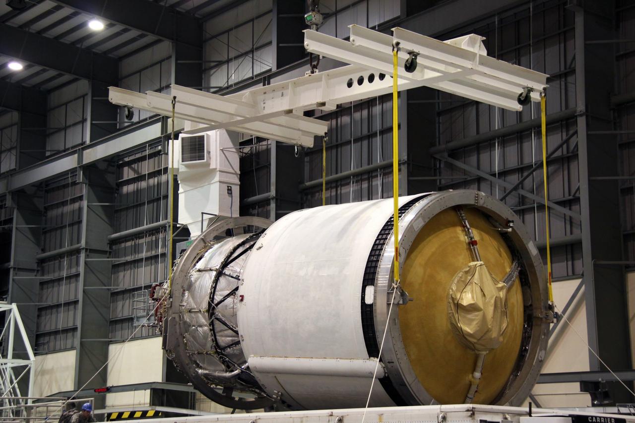 CAPE CANAVERAL, Fla. – The second stage of a Delta IV is lifted from its transporter in the Horizontal Integration Facility at Launch Complex 37 on Cape Canaveral Air Force Station in Florida. This United Launch Alliance Delta IV rocket is the vehicle slated to launch GOES-P, the latest Geostationary Operational Environmental Satellite developed by NASA for the National Oceanic and Atmospheric Administration, or NOAA. Processing of the Delta IV is on track for launch, targeted for March 4, 2010. For information on GOES-P, visit http://goespoes.gsfc.nasa.gov/goes/spacecraft/n_p_spacecraft.html. Photo credit: NASA/Jack Pfaller