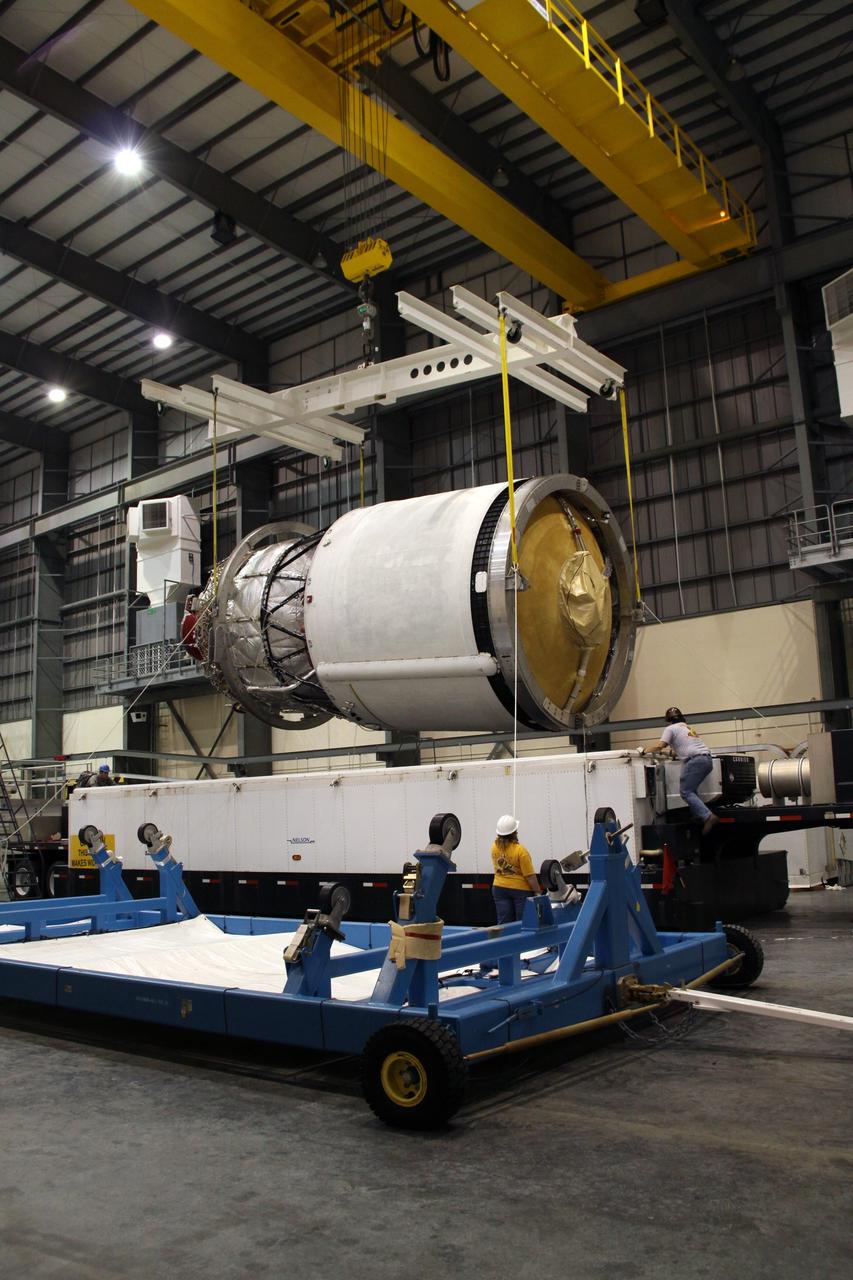 CAPE CANAVERAL, Fla. – The second stage of a Delta IV is suspended over its transporter in the Horizontal Integration Facility at Launch Complex 37 on Cape Canaveral Air Force Station in Florida. This United Launch Alliance Delta IV rocket is the vehicle slated to launch GOES-P, the latest Geostationary Operational Environmental Satellite developed by NASA for the National Oceanic and Atmospheric Administration, or NOAA. Processing of the Delta IV is on track for launch, targeted for March 4, 2010. For information on GOES-P, visit http://goespoes.gsfc.nasa.gov/goes/spacecraft/n_p_spacecraft.html. Photo credit: NASA/Jack Pfaller