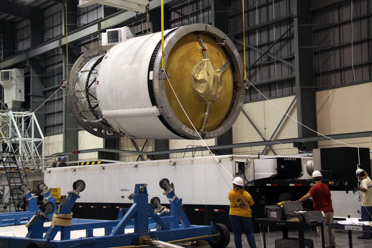 CAPE CANAVERAL, Fla. – Workers stabilize the second stage of a Delta IV as it is lifted by crane from its transporter in the Horizontal Integration Facility at Launch Complex 37 on Cape Canaveral Air Force Station in Florida.    This United Launch Alliance Delta IV rocket is the vehicle slated to launch GOES-P, the latest Geostationary Operational Environmental Satellite developed by NASA for the National Oceanic and Atmospheric Administration, or NOAA. Processing of the Delta IV is on track for launch, targeted for March 4, 2010.  For information on GOES-P, visit http://goespoes.gsfc.nasa.gov/goes/spacecraft/n_p_spacecraft.html. Photo credit: NASA/Jack Pfaller