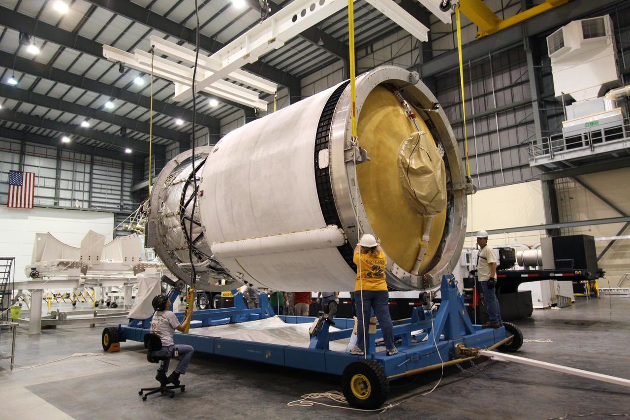 CAPE CANAVERAL, Fla. – Workers adjust the second stage of a Delta IV on its mobile work stand in the Horizontal Integration Facility at Launch Complex 37 on Cape Canaveral Air Force Station in Florida. This United Launch Alliance Delta IV rocket is the vehicle slated to launch GOES-P, the latest Geostationary Operational Environmental Satellite developed by NASA for the National Oceanic and Atmospheric Administration, or NOAA. Processing of the Delta IV is on track for launch, targeted for March 4, 2010. For information on GOES-P, visit http://goespoes.gsfc.nasa.gov/goes/spacecraft/n_p_spacecraft.html. Photo credit: NASA/Jack Pfaller