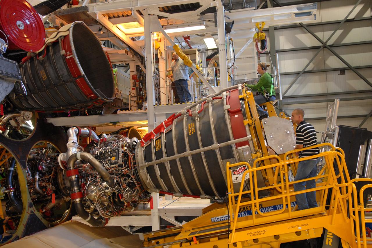 CAPE CANAVERAL, Fla. – Pratt & Whitney Rocketdyne technicians align a space shuttle main engine for installation on space shuttle Endeavour in Orbiter Processing Facility Bay 2 at NASA's Kennedy Space Center in Florida.  The engine will fly on the shuttle's STS-130 mission to the International Space Station.  Even though this engine weighs one-seventh as much as a locomotive engine, its high-pressure fuel pump alone delivers as much horsepower as 28 locomotives, while its high-pressure oxidizer pump delivers the equivalent horsepower of an additional 11 locomotives. The maximum equivalent horsepower developed by the shuttle's three main engines is more than 37 million horsepower.  Endeavour is targeted to launch Feb. 4, 2010. Photo credit: NASA/Jim Grossmann