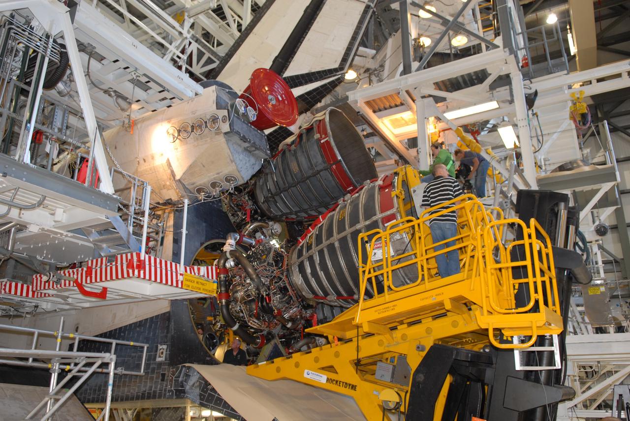 CAPE CANAVERAL, Fla. – A Pratt & Whitney Rocketdyne technician carefully maneuvers a space shuttle main engine into position on space shuttle Endeavour in Orbiter Processing Facility Bay 2 at NASA's Kennedy Space Center in Florida. The engine will fly on the shuttle's STS-130 mission to the International Space Station. Even though this engine weighs one-seventh as much as a locomotive engine, its high-pressure fuel pump alone delivers as much horsepower as 28 locomotives, while its high-pressure oxidizer pump delivers the equivalent horsepower of an additional 11 locomotives. The maximum equivalent horsepower developed by the shuttle's three main engines is more than 37 million horsepower. Endeavour is targeted to launch Feb. 4, 2010. Photo credit: NASA/Jim Grossmann