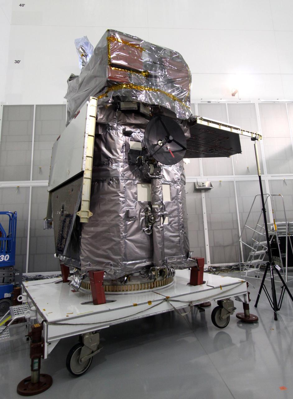 CAPE CANAVERAL, Fla. – At the Astrotech Space Operations facility in Titusville, Fla., one of the solar arrays on the Solar Dynamics Observatory, or SDO, has been deployed manually during preparations to test the release mechanism sequence for the arrays using signal commands.    SDO is the first space weather research network mission in NASA's Living With a Star Program. The spacecraft's long-term measurements will give solar scientists in-depth information about changes in the sun's magnetic field and insight into how they affect Earth. Liftoff on an Atlas V rocket is scheduled for Feb. 3, 2010. Photo credit: NASA/Jack Pfaller