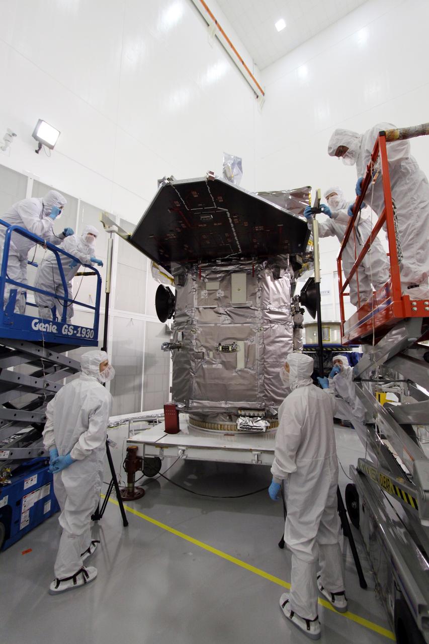 CAPE CANAVERAL, Fla. – At the Astrotech Space Operations facility in Titusville, Fla., spacecraft technicians have manually deployed the solar arrays on the Solar Dynamics Observatory, or SDO, during preparations to test the release mechanism sequence for the arrays using signal commands.    SDO is the first space weather research network mission in NASA's Living With a Star Program. The spacecraft's long-term measurements will give solar scientists in-depth information about changes in the sun's magnetic field and insight into how they affect Earth. Liftoff on an Atlas V rocket is scheduled for Feb. 3, 2010. Photo credit: NASA/Jack Pfaller