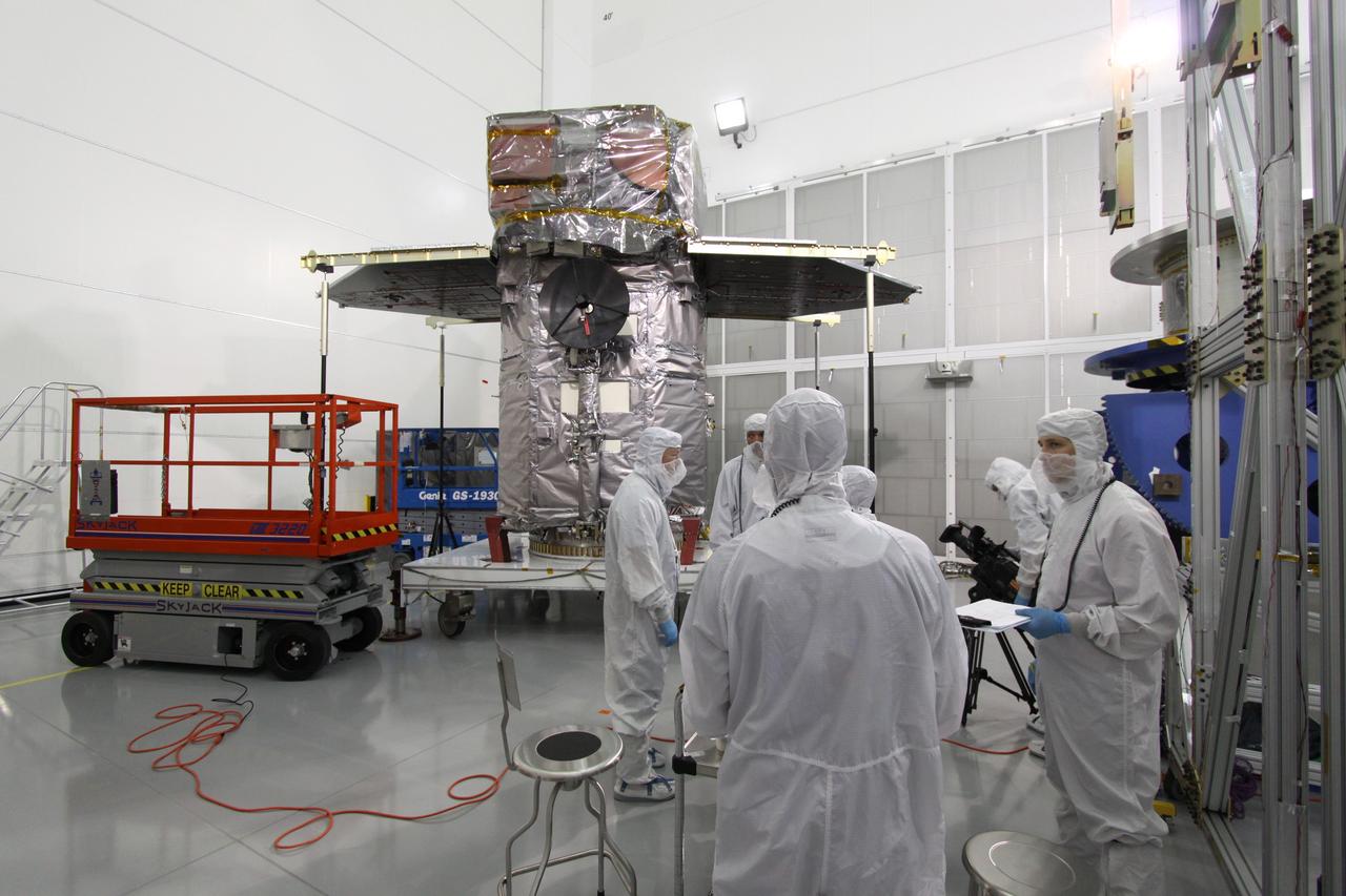 CAPE CANAVERAL, Fla. – At the Astrotech Space Operations facility in Titusville, Fla., spacecraft technicians make final preparations to test the release mechanism sequence for the solar arrays on the Solar Dynamics Observatory, or SDO, using signal commands.    SDO is the first space weather research network mission in NASA's Living With a Star Program. The spacecraft's long-term measurements will give solar scientists in-depth information about changes in the sun's magnetic field and insight into how they affect Earth. Liftoff on an Atlas V rocket is scheduled for Feb. 3, 2010. Photo credit: NASA/Jack Pfaller