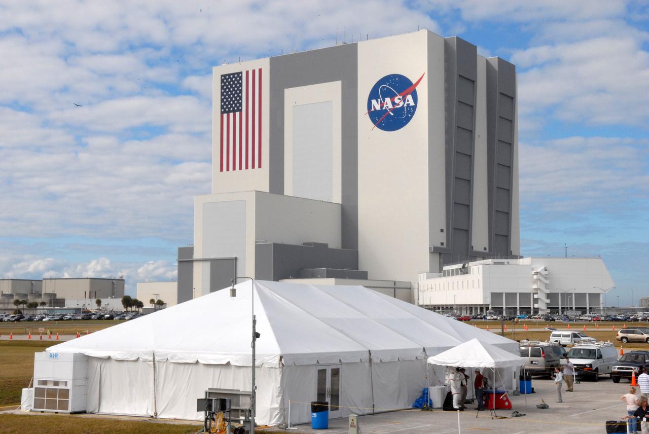 CAPE CANAVERAL, Fla. - At the NASA Press Site at NASA's Kennedy Space Center in Florida, a tent is erected in the shadow of the 525-foot-tall Vehicle Assembly Building for a unique event, a Tweetup, being held to share the excitement of a space shuttle launch with a new audience. The two-day event will provide NASA Twitter followers the opportunity to take a tour of Kennedy, view a shuttle launch and speak with shuttle technicians, engineers, astronauts and managers, as well as the staff behind the tweets on @NASA. Launch of shuttle Atlantis on the STS-129 mission to the International Space Station is scheduled for 2:28 p.m. EST on Nov. 16. For information on the STS-129 mission and crew, visit http://www.nasa.gov/mission_pages/shuttle/shuttlemissions/sts129/index.html. Photo credit: NASA/Jim Grossmann