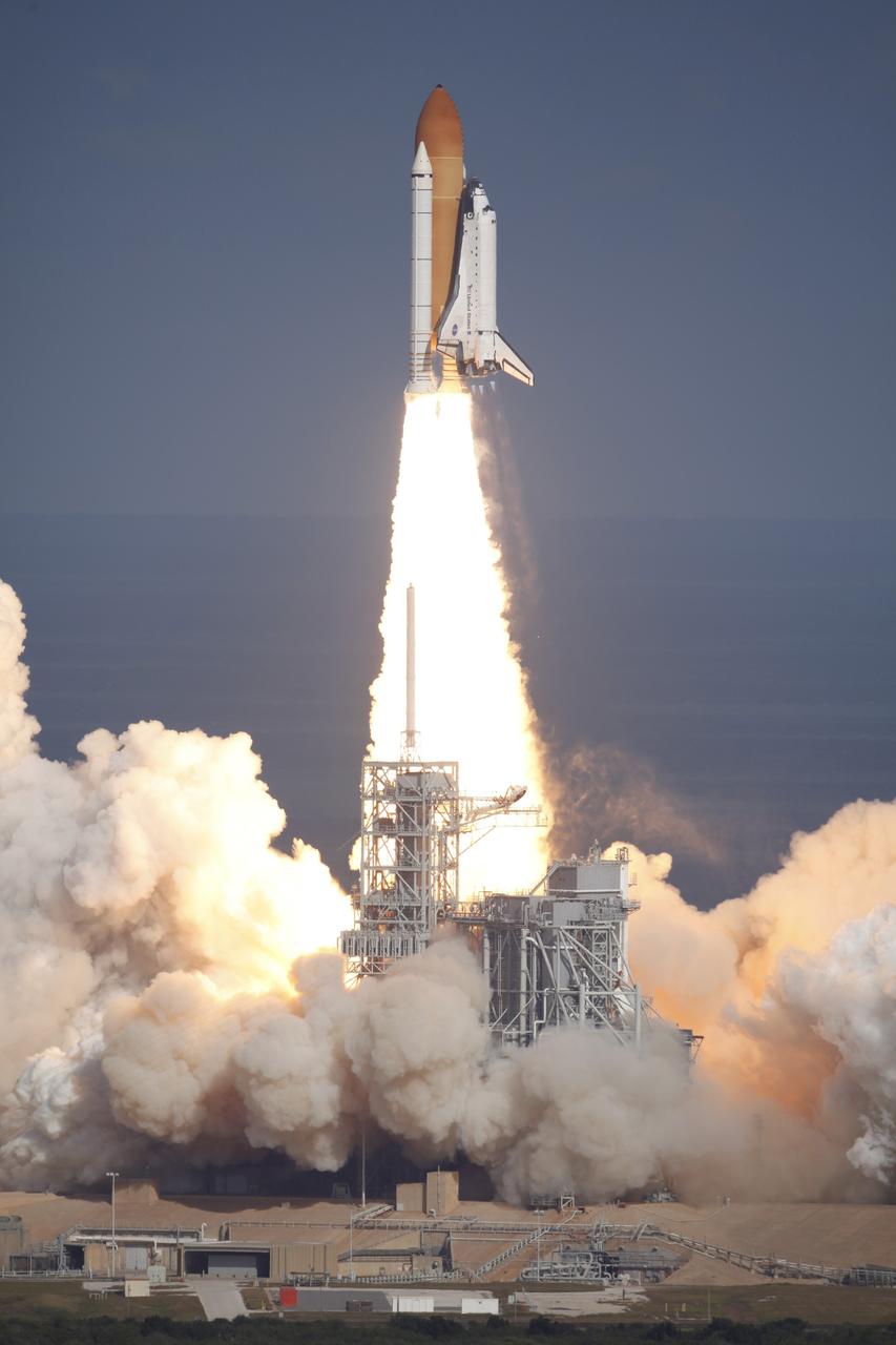 CAPE CANAVERAL, Fla. - Like a phoenix rising from the flames, space shuttle Atlantis emerges from the exhaust cloud on Launch Pad 39A at NASA's Kennedy Space Center in Florida.    Liftoff on its STS-129 mission came at 2:28 p.m. EST Nov. 16.  Aboard are crew members Commander Charles O. Hobaugh; Pilot Barry E. Wilmore; and Mission Specialists Leland Melvin, Randy Bresnik, Mike Foreman and Robert L. Satcher Jr.  On STS-129, the crew will deliver two ExPRESS Logistics Carriers to the International Space Station, the largest of the shuttle's cargo carriers, containing 15 spare pieces of equipment including two gyroscopes, two nitrogen tank assemblies, two pump modules, an ammonia tank assembly and a spare latching end effector for the station's robotic arm.  Atlantis will return to Earth a station crew member, Nicole Stott, who has spent more than two months aboard the orbiting laboratory.  STS-129 is slated to be the final space shuttle Expedition crew rotation flight. For information on the STS-129 mission and crew, visit http://www.nasa.gov/mission_pages/shuttle/shuttlemissions/sts129/index.html.    Photo courtesy of Scott Andrews