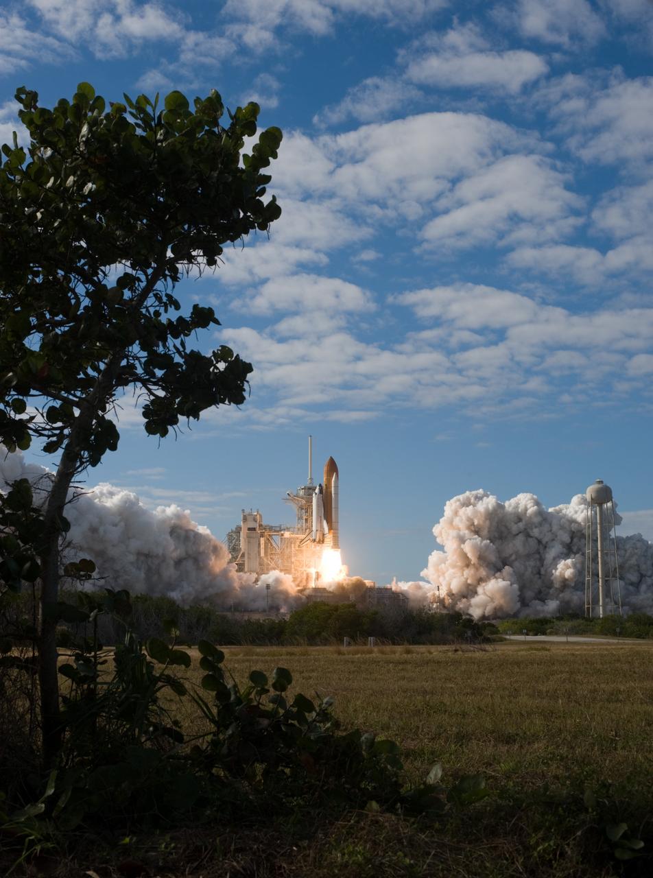 CAPE CANAVERAL, Fla. -  An exhaust cloud builds on Launch Pad 39A as the solid rocket motors ignite, launching space shuttle Atlantis on a balmy Florida afternoon at NASA's Kennedy Space Center.    Liftoff on its STS-129 mission came at 2:28 p.m. EST Nov. 16.  Aboard are crew members Commander Charles O. Hobaugh; Pilot Barry E. Wilmore; and Mission Specialists Leland Melvin, Randy Bresnik, Mike Foreman and Robert L. Satcher Jr.  On STS-129, the crew will deliver two ExPRESS Logistics Carriers to the International Space Station, the largest of the shuttle's cargo carriers, containing 15 spare pieces of equipment including two gyroscopes, two nitrogen tank assemblies, two pump modules, an ammonia tank assembly and a spare latching end effector for the station's robotic arm.  Atlantis will return to Earth a station crew member, Nicole Stott, who has spent more than two months aboard the orbiting laboratory.  STS-129 is slated to be the final space shuttle Expedition crew rotation flight. For information on the STS-129 mission and crew, visit http://www.nasa.gov/mission_pages/shuttle/shuttlemissions/sts129/index.html.    Photo credit: NASA/Sandra Joseph and Kevin O'Connell