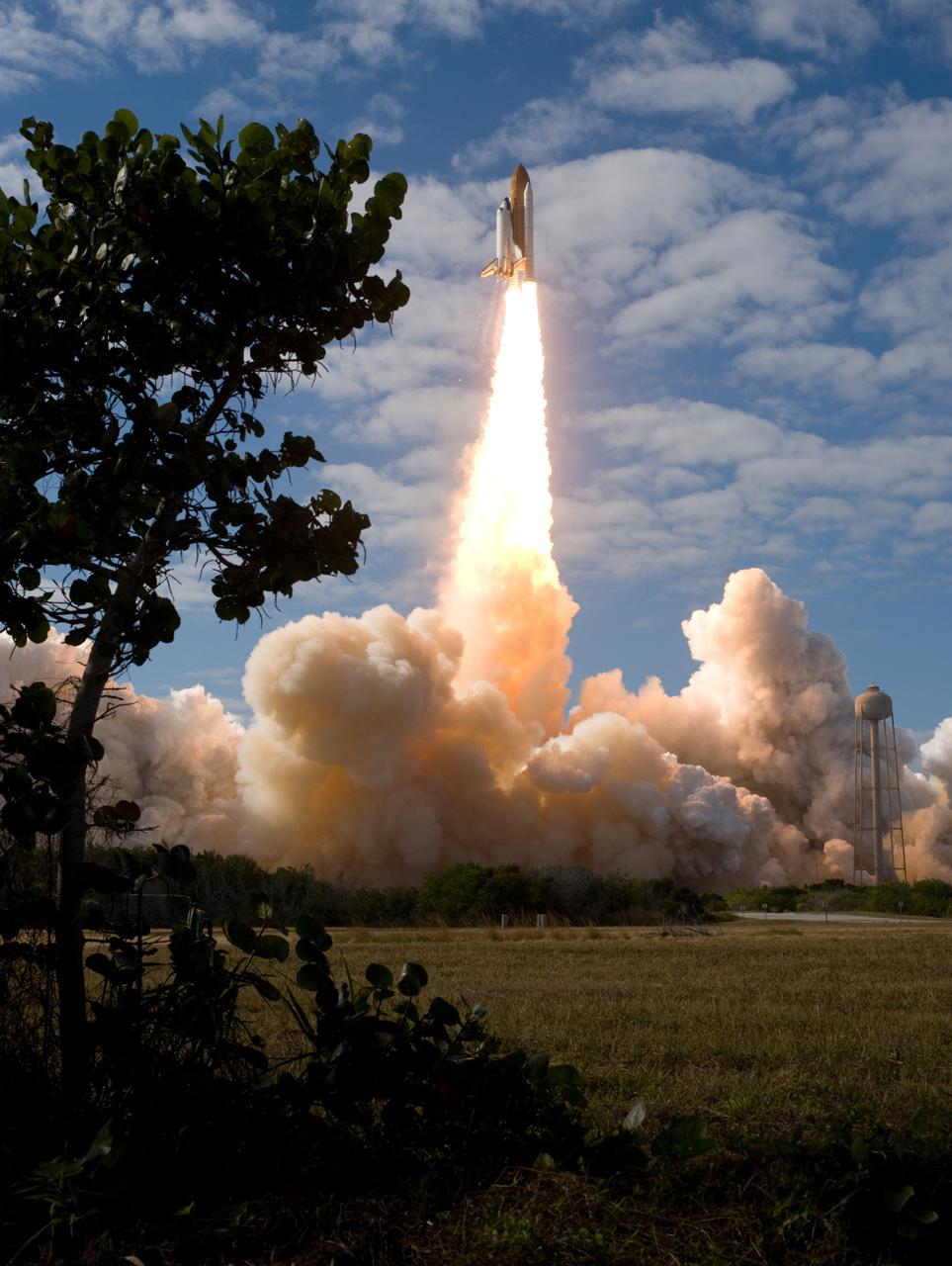 CAPE CANAVERAL, Fla. - Like a phoenix rising from the flames, space shuttle Atlantis emerges from the exhaust cloud building on Launch Pad 39A at NASA's Kennedy Space Center in Florida.    Liftoff on its STS-129 mission came at 2:28 p.m. EST Nov. 16.  Aboard are crew members Commander Charles O. Hobaugh; Pilot Barry E. Wilmore; and Mission Specialists Leland Melvin, Randy Bresnik, Mike Foreman and Robert L. Satcher Jr.  On STS-129, the crew will deliver two ExPRESS Logistics Carriers to the International Space Station, the largest of the shuttle's cargo carriers, containing 15 spare pieces of equipment including two gyroscopes, two nitrogen tank assemblies, two pump modules, an ammonia tank assembly and a spare latching end effector for the station's robotic arm.  Atlantis will return to Earth a station crew member, Nicole Stott, who has spent more than two months aboard the orbiting laboratory.  STS-129 is slated to be the final space shuttle Expedition crew rotation flight. For information on the STS-129 mission and crew, visit http://www.nasa.gov/mission_pages/shuttle/shuttlemissions/sts129/index.html.    Photo credit: NASA/Sandra Joseph and Kevin O'Connell