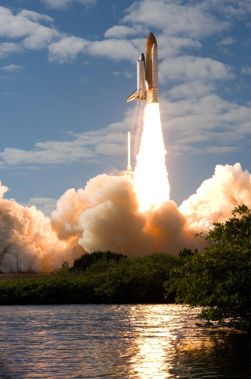 CAPE CANAVERAL, Fla. - Like a phoenix rising from the flames, space shuttle Atlantis emerges from the exhaust cloud building on Launch Pad 39A at NASA's Kennedy Space Center in Florida.    Liftoff on its STS-129 mission came at 2:28 p.m. EST Nov. 16.  Aboard are crew members Commander Charles O. Hobaugh; Pilot Barry E. Wilmore; and Mission Specialists Leland Melvin, Randy Bresnik, Mike Foreman and Robert L. Satcher Jr.  On STS-129, the crew will deliver two ExPRESS Logistics Carriers to the International Space Station, the largest of the shuttle's cargo carriers, containing 15 spare pieces of equipment including two gyroscopes, two nitrogen tank assemblies, two pump modules, an ammonia tank assembly and a spare latching end effector for the station's robotic arm.  Atlantis will return to Earth a station crew member, Nicole Stott, who has spent more than two months aboard the orbiting laboratory.  STS-129 is slated to be the final space shuttle Expedition crew rotation flight. For information on the STS-129 mission and crew, visit http://www.nasa.gov/mission_pages/shuttle/shuttlemissions/sts129/index.html.    Photo credit: NASA/Sandra Joseph and Kevin O'Connell