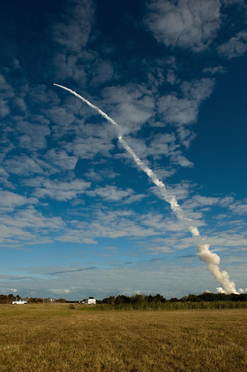CAPE CANAVERAL, Fla. - Space shuttle Atlantis leaves a contrail through the clouds over Launch Pad 39A at NASA's Kennedy Space Center in Florida.     Liftoff on its STS-129 mission came at 2:28 p.m. EST Nov. 16.  Aboard are crew members Commander Charles O. Hobaugh; Pilot Barry E. Wilmore; and Mission Specialists Leland Melvin, Randy Bresnik, Mike Foreman and Robert L. Satcher Jr.  On STS-129, the crew will deliver two ExPRESS Logistics Carriers to the International Space Station, the largest of the shuttle's cargo carriers, containing 15 spare pieces of equipment including two gyroscopes, two nitrogen tank assemblies, two pump modules, an ammonia tank assembly and a spare latching end effector for the station's robotic arm.  Atlantis will return to Earth a station crew member, Nicole Stott, who has spent more than two months aboard the orbiting laboratory.  STS-129 is slated to be the final space shuttle Expedition crew rotation flight. For information on the STS-129 mission and crew, visit http://www.nasa.gov/mission_pages/shuttle/shuttlemissions/sts129/index.html.    Photo credit: NASA/Carl Winebarger