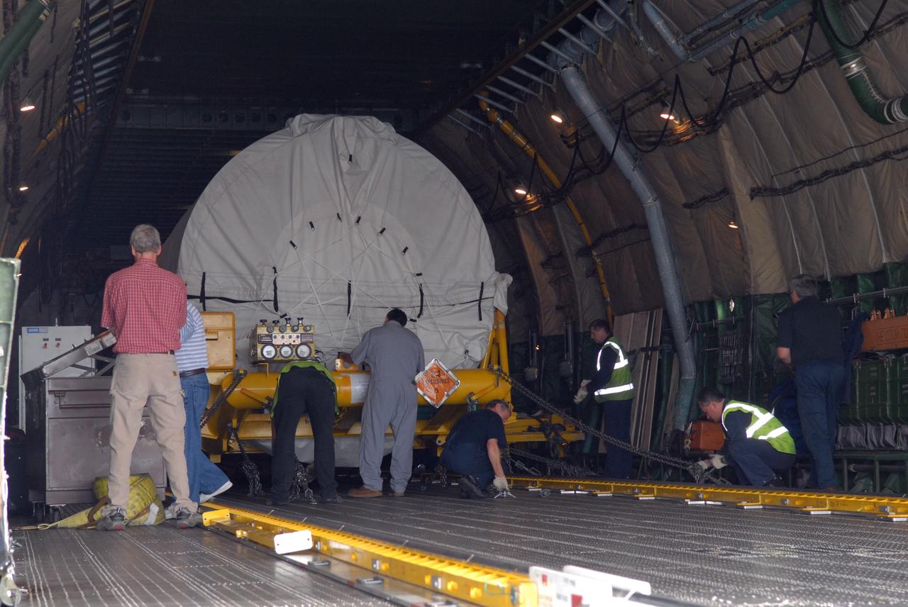 CAPE CANAVERAL, Fla. – At the Skid Strip on Cape Canaveral Air Force Station in Florida, workers prepare to offload the Centaur second stage for the Atlas V rocket slated to launch NASA's Solar Dynamics Observatory, or SDO, from a Volga-Dnepr Antonov AN-124-100, a Ukranian/Russian aircraft.    SDO is the first space weather research network mission in NASA's Living With a Star Program. The spacecraft's long-term measurements will give solar scientists in-depth information about changes in the sun's magnetic field and insight into how they affect Earth. Liftoff on the United Launch Alliance Atlas V is scheduled for Feb. 3, 2010. For information on SDO, visit http://www.nasa.gov/sdo.  Photo credit: NASA/Jim Grossmann