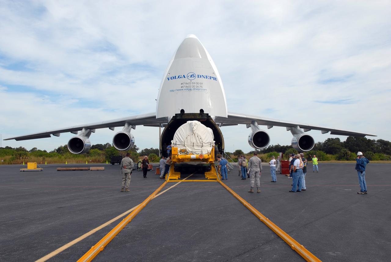 CAPE CANAVERAL, Fla. – At the Skid Strip on Cape Canaveral Air Force Station in Florida, workers offload the Centaur second stage for the Atlas V rocket slated to launch NASA's Solar Dynamics Observatory, or SDO, from a Volga-Dnepr Antonov AN-124-100, a Ukranian/Russian aircraft.    SDO is the first space weather research network mission in NASA's Living With a Star Program. The spacecraft's long-term measurements will give solar scientists in-depth information about changes in the sun's magnetic field and insight into how they affect Earth. Liftoff on the United Launch Alliance Atlas V is scheduled for Feb. 3, 2010. For information on SDO, visit http://www.nasa.gov/sdo.  Photo credit: NASA/Jim Grossmann