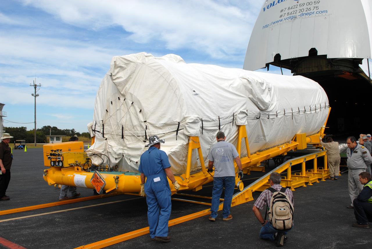 CAPE CANAVERAL, Fla. – At the Skid Strip on Cape Canaveral Air Force Station in Florida, workers roll the Centaur second stage for the Atlas V rocket slated to launch NASA's Solar Dynamics Observatory, or SDO, off a Volga-Dnepr Antonov AN-124-100, a Ukranian/Russian aircraft.    SDO is the first space weather research network mission in NASA's Living With a Star Program. The spacecraft's long-term measurements will give solar scientists in-depth information about changes in the sun's magnetic field and insight into how they affect Earth. Liftoff on the United Launch Alliance Atlas V is scheduled for Feb. 3, 2010. For information on SDO, visit http://www.nasa.gov/sdo.  Photo credit: NASA/Jim Grossmann