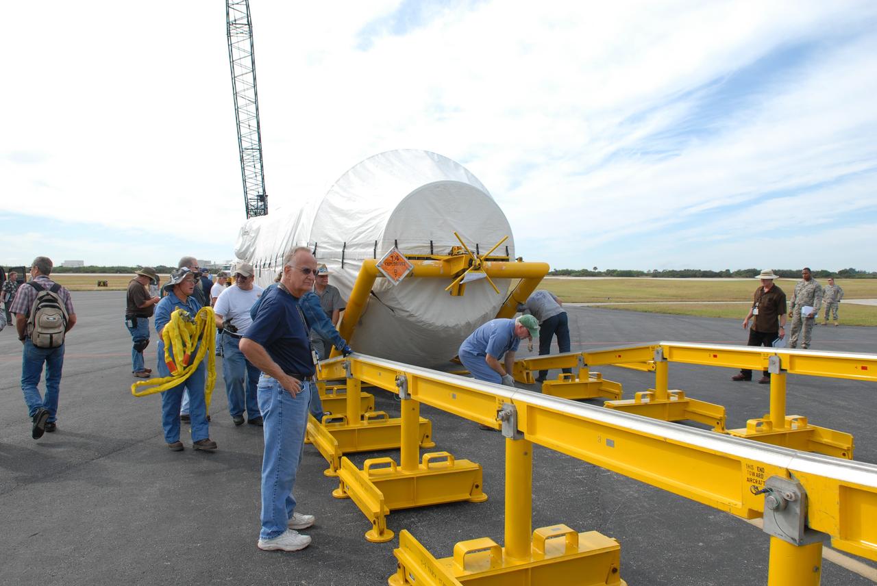 CAPE CANAVERAL, Fla. – At the Skid Strip on Cape Canaveral Air Force Station in Florida, workers roll the Centaur second stage for the Atlas V rocket slated to launch NASA's Solar Dynamics Observatory, or SDO, from Volga-Dnepr Antonov AN-124-100, a Ukranian/Russian aircraft, in which it was delivered.    SDO is the first space weather research network mission in NASA's Living With a Star Program. The spacecraft's long-term measurements will give solar scientists in-depth information about changes in the sun's magnetic field and insight into how they affect Earth. Liftoff on the United Launch Alliance Atlas V is scheduled for Feb. 3, 2010. For information on SDO, visit http://www.nasa.gov/sdo.  Photo credit: NASA/Jim Grossmann