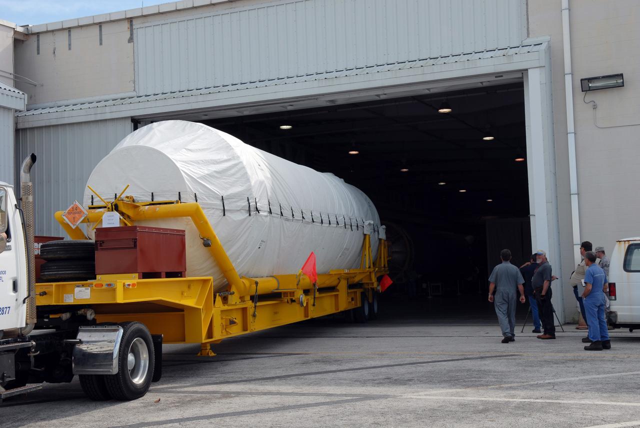 CAPE CANAVERAL, Fla. – The Centaur second stage for the Atlas V rocket slated to launch NASA's Solar Dynamics Observatory, or SDO, is moved into the hangar at the Atlas Spaceflight Operations Center on Cape Canaveral Air Force Station in Florida.    SDO is the first space weather research network mission in NASA's Living With a Star Program. The spacecraft's long-term measurements will give solar scientists in-depth information about changes in the sun's magnetic field and insight into how they affect Earth. Liftoff on the United Launch Alliance Atlas V is scheduled for Feb. 3, 2010. For information on SDO, visit http://www.nasa.gov/sdo.  Photo credit: NASA/Jim Grossmann