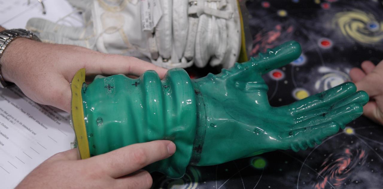 CAPE CANAVERAL, Fla. – This newly designed glove is one of the entries in the 2009 Astronaut Glove Challenge, part of NASA’s Centennial Challenges Program, at the Astronaut Hall of Fame near NASA’s Kennedy Space Center in Florida.    The nationwide competition focused on developing improved pressure suit gloves for astronauts to use while working in space.  During the challenge, inventors tested the gloves to measure dexterity and strength during operation in a glove box which simulates the vacuum of space.  Centennial Challenges is NASA’s program of technology prizes for the citizen-inventor.  The winning prize for the Glove Challenge is $250,000 provided by the Centennial Challenges Program.  Photo credit: NASA/Kim Shiflett
