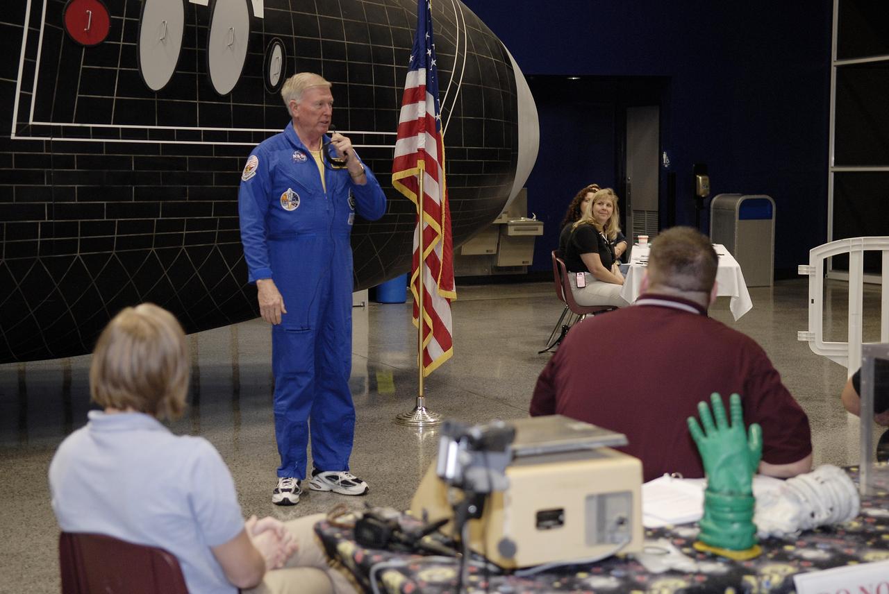 CAPE CANAVERAL, Fla. – Former NASA astronaut Jon McBride, at microphone, addresses the participants in the 2009 Astronaut Glove Challenge, part of NASA’s Centennial Challenges Program, at the Astronaut Hall of Fame near NASA’s Kennedy Space Center in Florida.    The nationwide competition focused on developing improved pressure suit gloves for astronauts to use while working in space.  During the challenge, inventors tested the gloves to measure dexterity and strength during operation in a glove box which simulates the vacuum of space.  Centennial Challenges is NASA’s program of technology prizes for the citizen-inventor.  The winning prize for the Glove Challenge is $250,000 provided by the Centennial Challenges Program.  Photo credit: NASA/Kim Shiflett