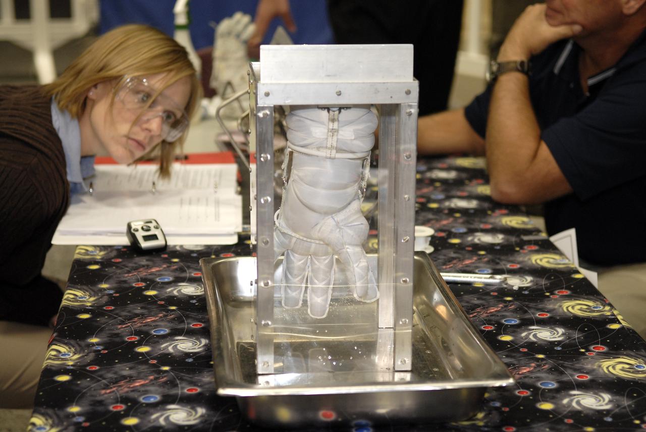 CAPE CANAVERAL, Fla. – A newly designed glove is submitted to a burst test to determine how much internal pressure it can withstand at the 2009 Astronaut Glove Challenge, part of NASA’s Centennial Challenges Program, at the Astronaut Hall of Fame near NASA’s Kennedy Space Center in Florida.    The nationwide competition focused on developing improved pressure suit gloves for astronauts to use while working in space.  During the challenge, the gloves were submitted to burst tests, joint force tests and tests to measure their dexterity and strength during operation in a glove box which simulates the vacuum of space.  Centennial Challenges is NASA’s program of technology prizes for the citizen-inventor. The winning prize for the Glove Challenge is $250,000 provided by the Centennial Challenges Program.  Photo credit: NASA/Kim Shiflett