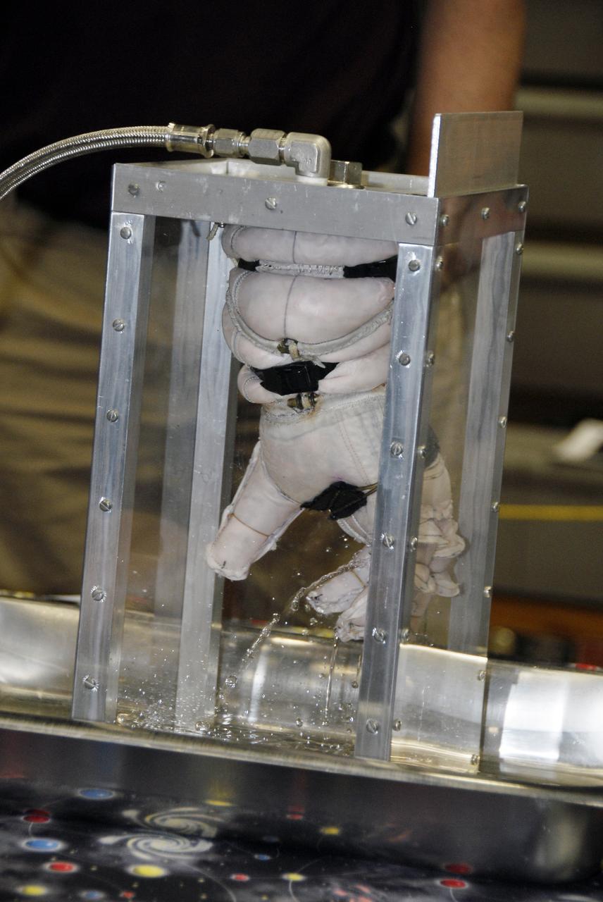CAPE CANAVERAL, Fla. – A newly designed glove is submitted to a burst test to determine how much internal pressure it can withstand at the 2009 Astronaut Glove Challenge, part of NASA’s Centennial Challenges Program, at the Astronaut Hall of Fame near NASA’s Kennedy Space Center in Florida.    The nationwide competition focused on developing improved pressure suit gloves for astronauts to use while working in space.  During the challenge, the gloves were submitted to burst tests, joint force tests and tests to measure their dexterity and strength during operation in a glove box which simulates the vacuum of space.  Centennial Challenges is NASA’s program of technology prizes for the citizen-inventor. The winning prize for the Glove Challenge is $250,000 provided by the Centennial Challenges Program.  Photo credit: NASA/Kim Shiflett