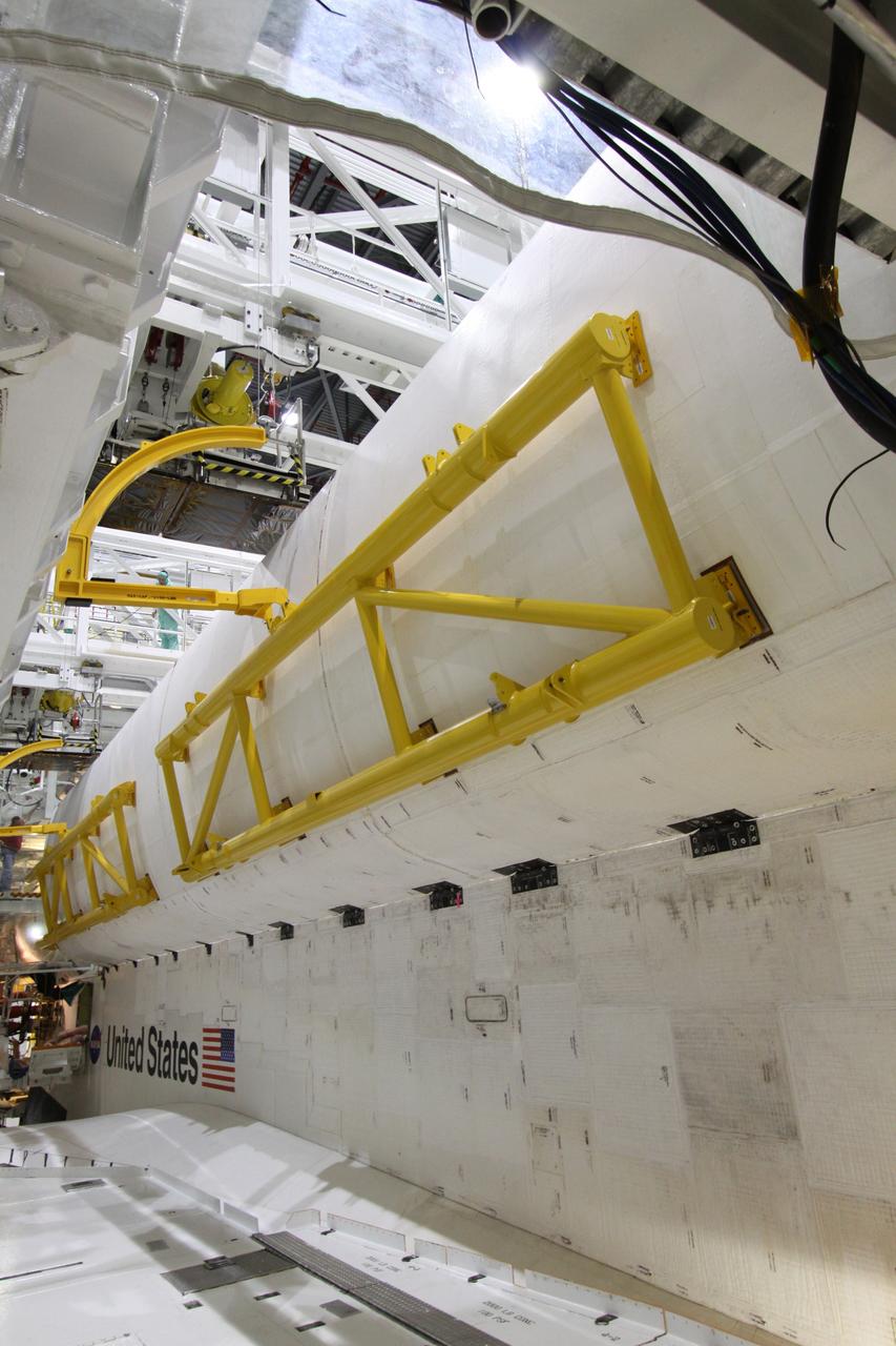 CAPE CANAVERAL, Fla. – In Orbiter Processing Facility-2 at NASA's Kennedy Space Center in Florida, space shuttle Endeavour's payload bay doors are being closed for the shuttle's move to the Vehicle Assembly Building. The move, or "rollover," is targeted for Dec. 12. The Tranquility module, the payload for Endeavour's STS-130 mission to the International Space Station, will be installed in the payload bay after the shuttle has reached the pad. Endeavour's launch is targeted for Feb. 4, 2010. For information on the STS-130 mission and crew, visit http://www.nasa.gov/mission_pages/shuttle/shuttlemissions/sts130/index.html. Photo credit: NASA/Jack Pfaller