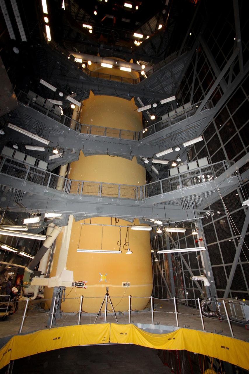 CAPE CANAVERAL, Fla. – In the Vehicle Assembly Building at NASA's Kennedy Space Center in Florida, the external tank for space shuttle Endeavour's STS-130 mission, ET-134, is prepared for transfer from its test cell to High Bay-1 for mating with the twin solid rocket boosters that will be used on the mission. Endeavour's move, or "rollover," from Orbiter Processing Facility-2 is targeted for Dec. 12. The Tranquility module, the payload for the STS-130 mission to the International Space Station, will be installed in the payload bay after the shuttle has reached the pad. Endeavour's launch is targeted for Feb. 4, 2010. For information on the STS-130 mission and crew, visit http://www.nasa.gov/mission_pages/shuttle/shuttlemissions/sts130/index.html. Photo credit: NASA/Jack Pfaller