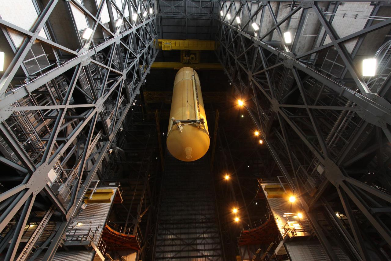 CAPE CANAVERAL, Fla. – In the Vehicle Assembly Building at NASA's Kennedy Space Center in Florida, the external tank for space shuttle Endeavour's STS-130 mission, ET-134, is moved from its test cell into High Bay-1 where it will be mated with the twin solid rocket boosters that will be used on the mission. Endeavour's move, or "rollover," from Orbiter Processing Facility-2 is targeted for Dec. 12. The Tranquility module, the payload for the STS-130 mission to the International Space Station, will be installed in the payload bay after the shuttle has reached the pad. Endeavour's launch is targeted for Feb. 4, 2010. For information on the STS-130 mission and crew, visit http://www.nasa.gov/mission_pages/shuttle/shuttlemissions/sts130/index.html. Photo credit: NASA/Jack Pfaller